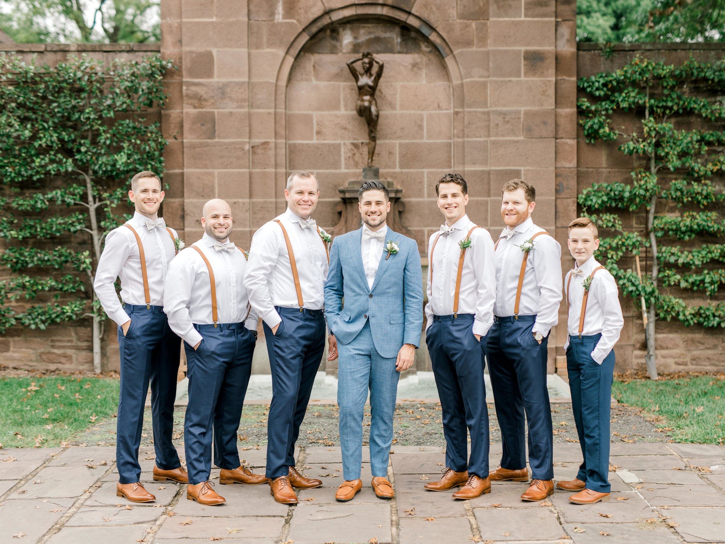Timeless, fresh, and bright are just a few words to describe these stylish groomsmen in blue and white and leather accents from this bright boho chic Tyler Gardens wedding in Bucks County
