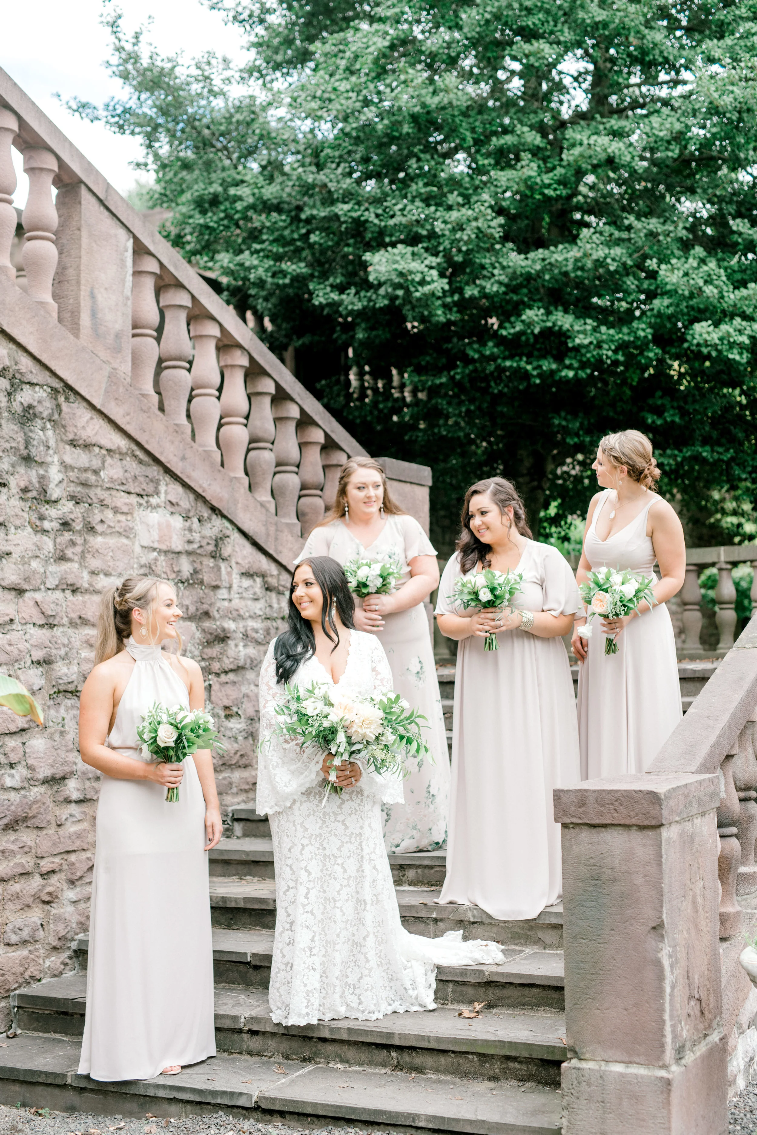 These bridesmaids in their shades of nude and gray looked absolutely from a fairytale for this bright boho chic Tyler Gardens wedding in Bucks County