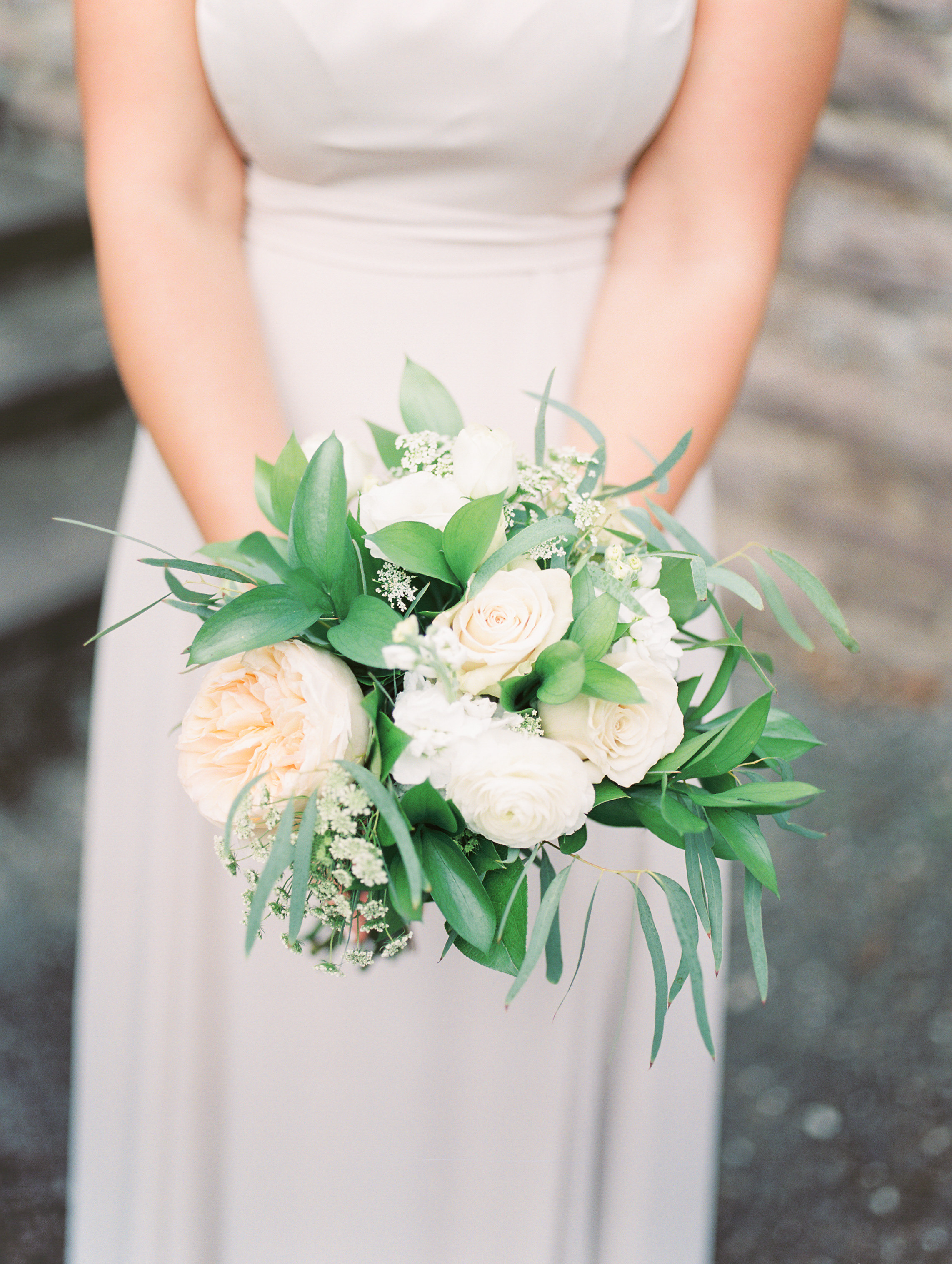 We love all the greenery and muted tones in this bridesmaid bouquet by Maura Rose Events from this bright boho chic Tyler Gardens wedding in Bucks County