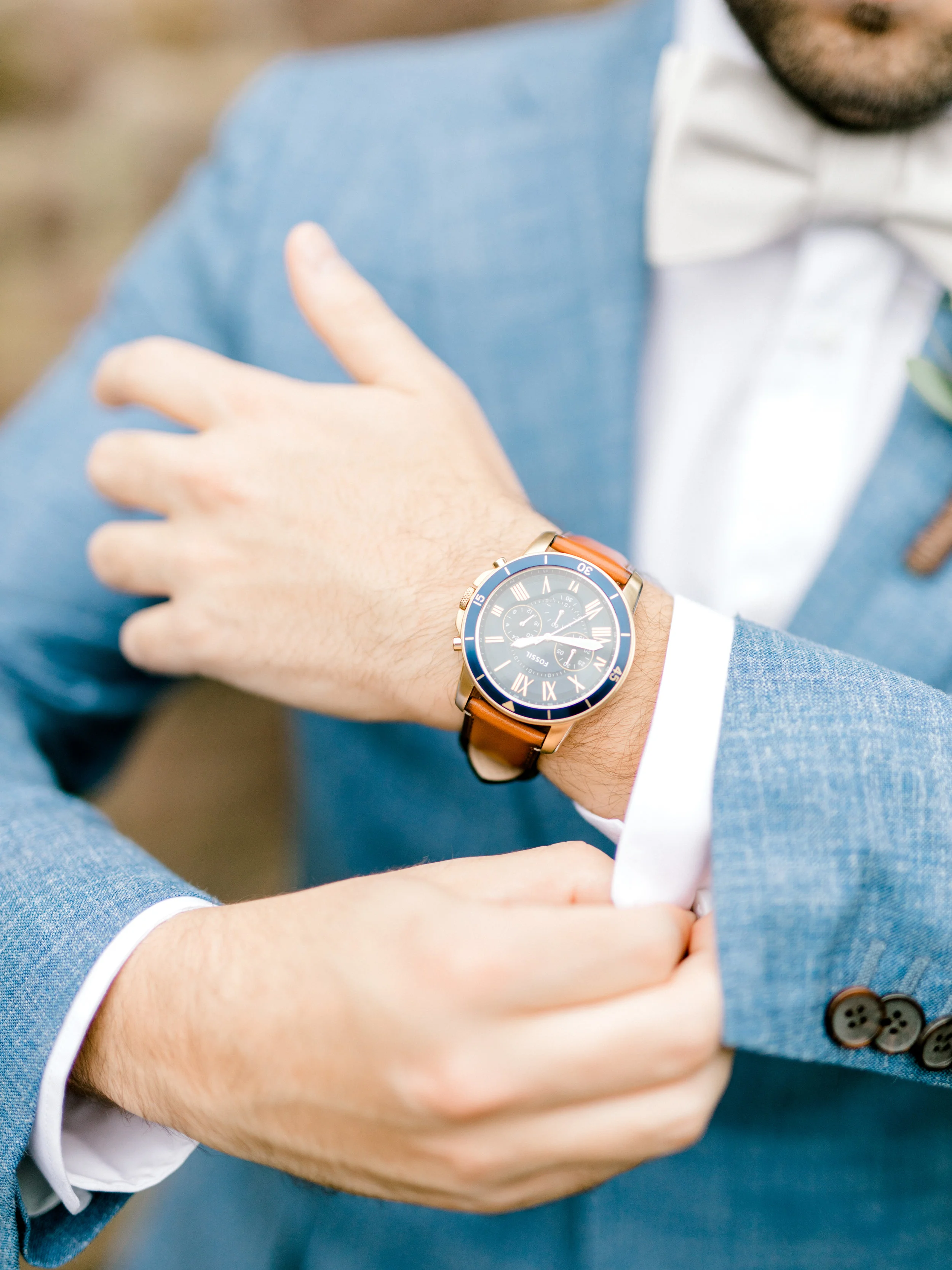 I’m loving this stylish watch with leather strap mixed with Mike’s light blue suit for his bright boho chic Tyler Gardens wedding in Bucks County