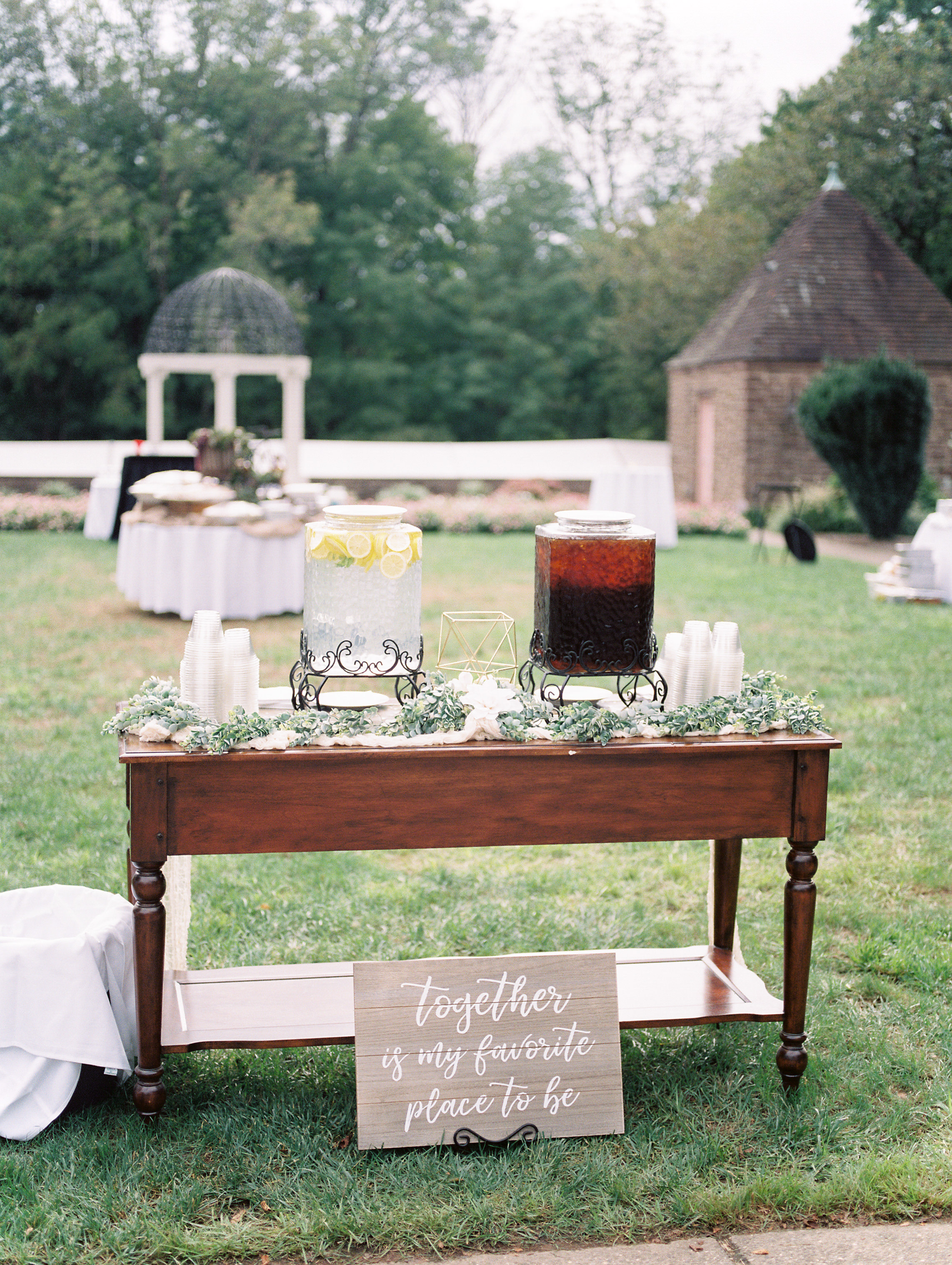 Refreshments await at this elegant cocktail hour set-up in the garden from this bright boho chic Tyler Gardens wedding in Bucks County