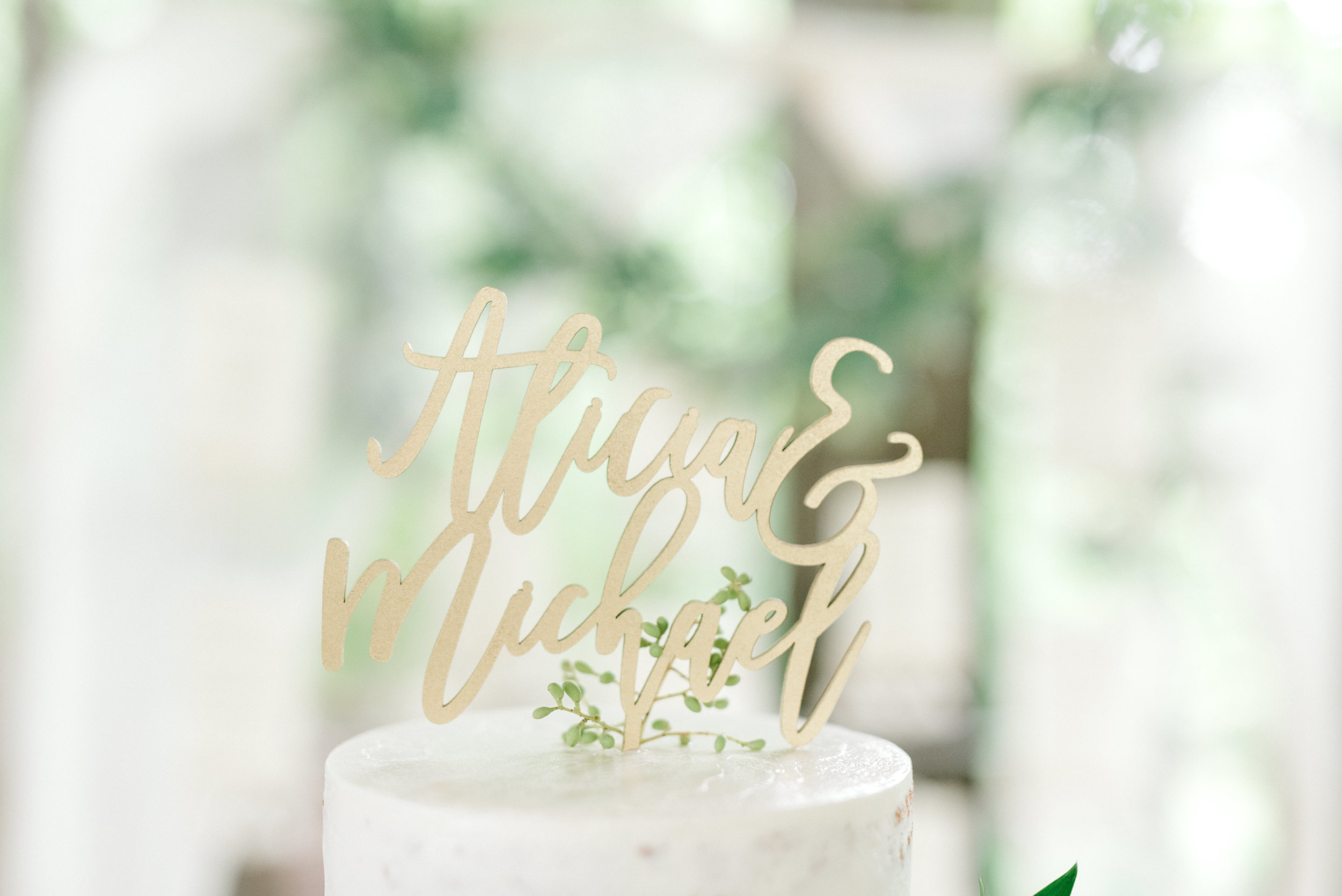 A modern laser cut cake topper in an elegant script made a beautiful touch to this bright boho chic Tyler Gardens wedding in Bucks County