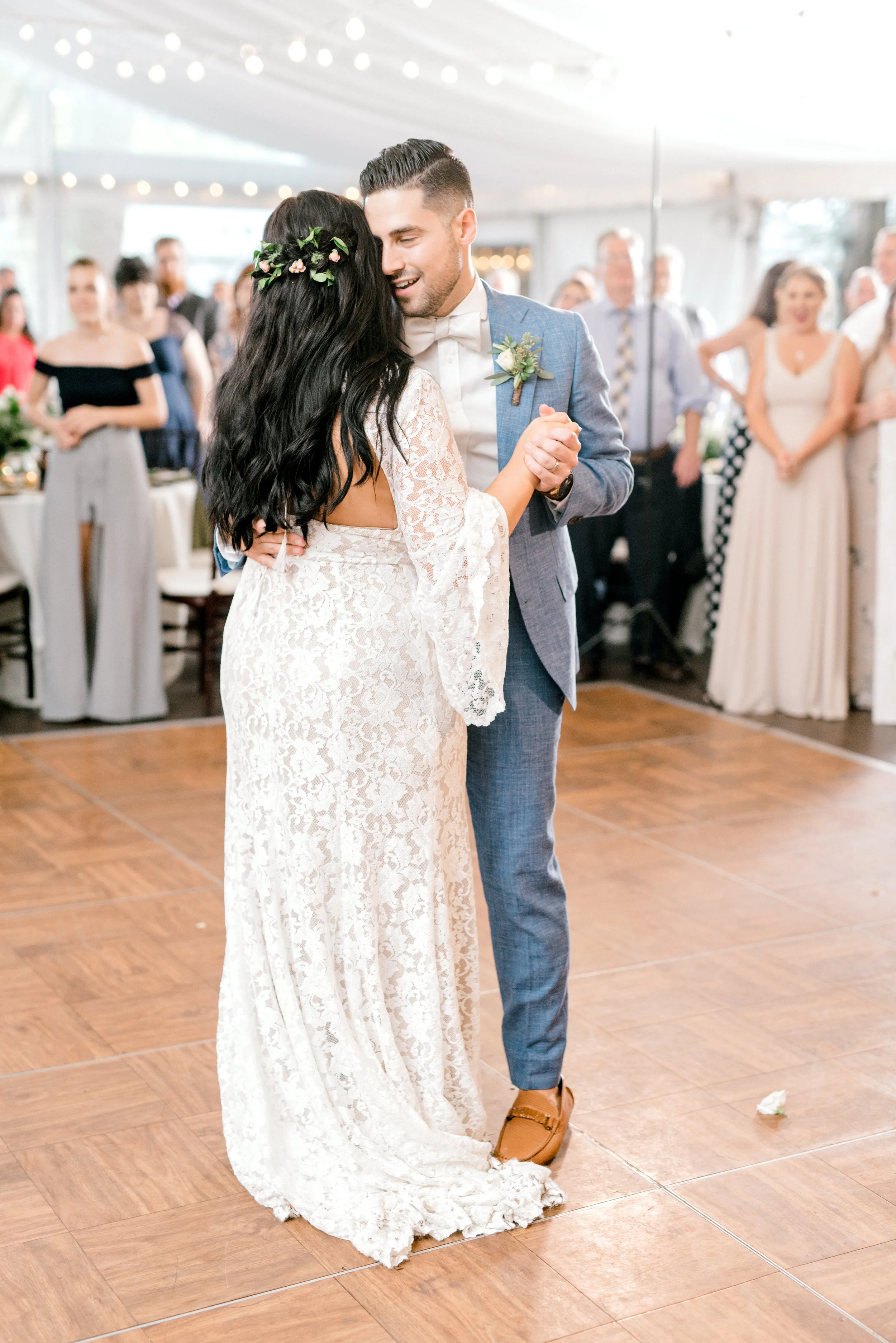 A first dance to remember as Alicia and Mike hold each other on the dance floor at their bright boho chic Tyler Gardens wedding in Bucks County