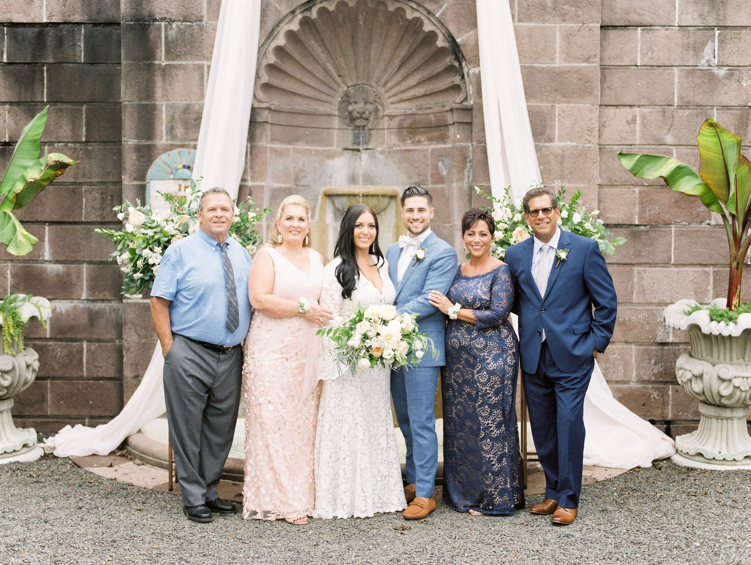 The beautiful stonework and arches from the bright boho chic Tyler Gardens wedding in Bucks County make for the best family portraits