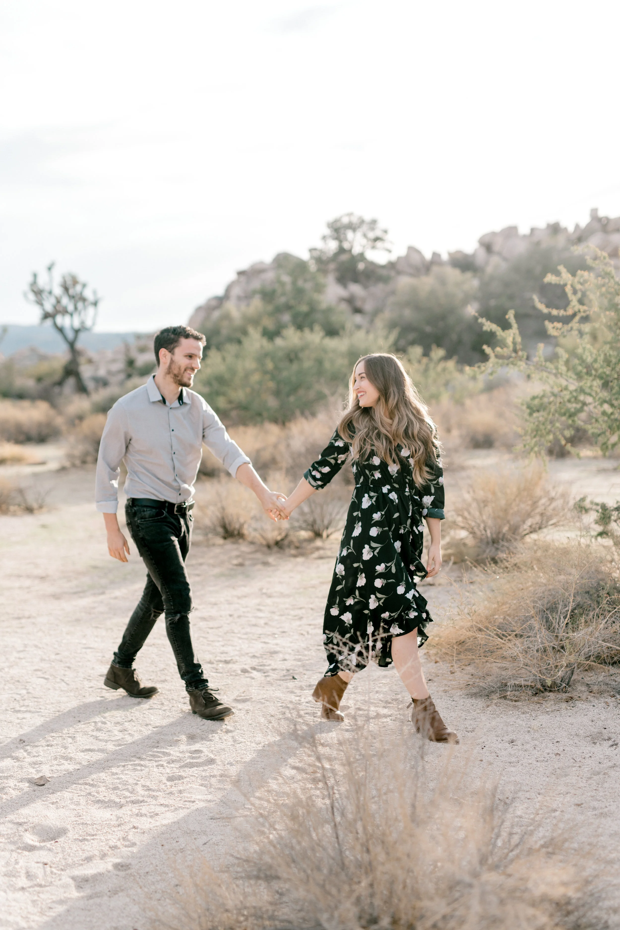 This floral boho look made for a perfect complement to the barren scene in this free-spirited desert engagement session in Joshue Tree