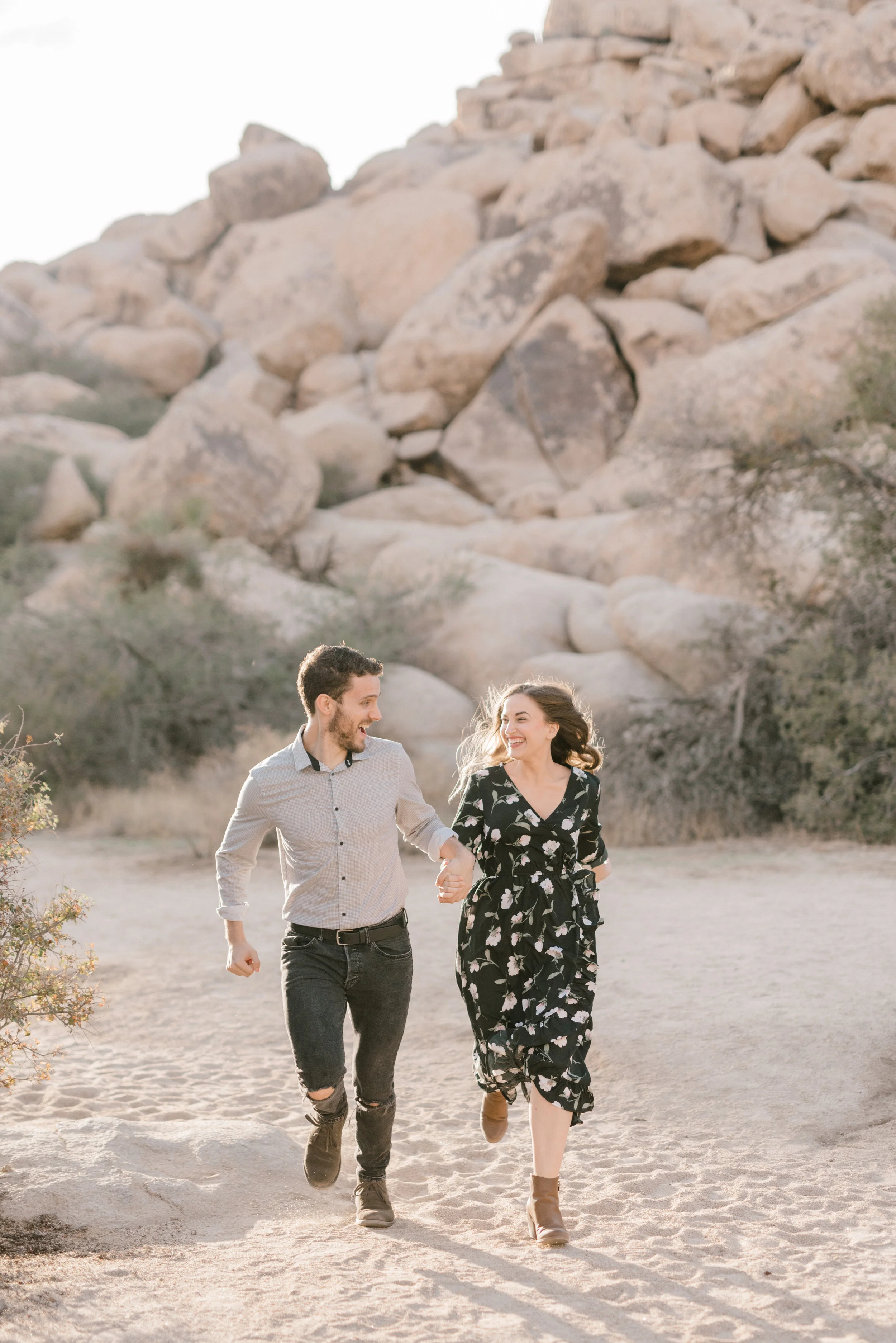 Running off into the sunset, this boho couple had so much frolicking through the desert for their free-spirited engagement session in Joshue Tree
