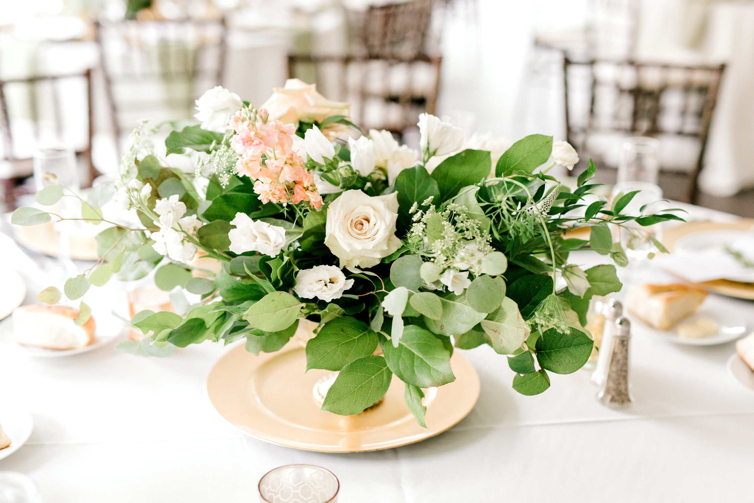 We loved the wild green compote centerpieces with white and blush blooms from this bright boho chic Tyler Gardens wedding in Bucks County