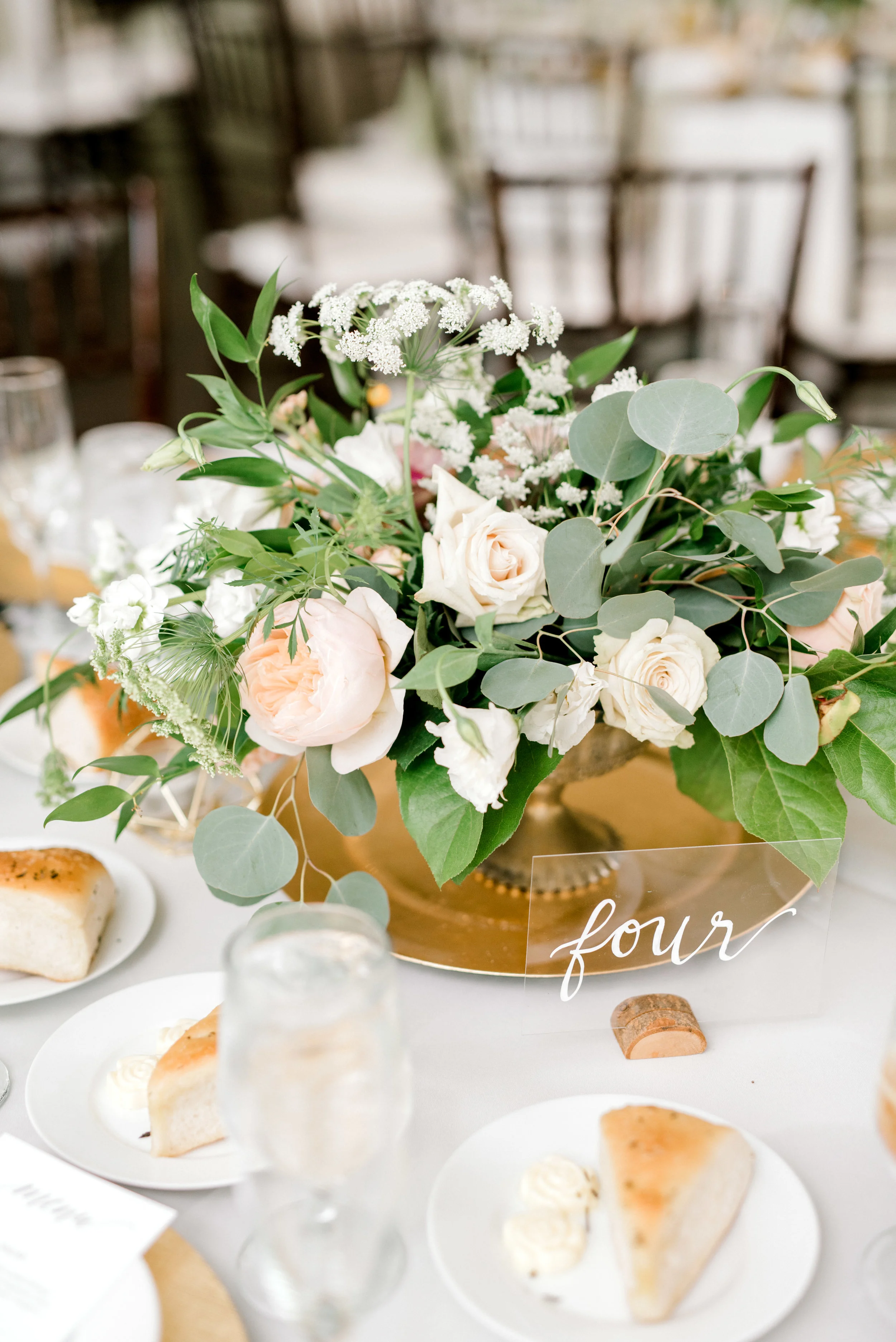 We loved the wild green compote centerpieces with white and blush blooms from this bright boho chic Tyler Gardens wedding in Bucks County