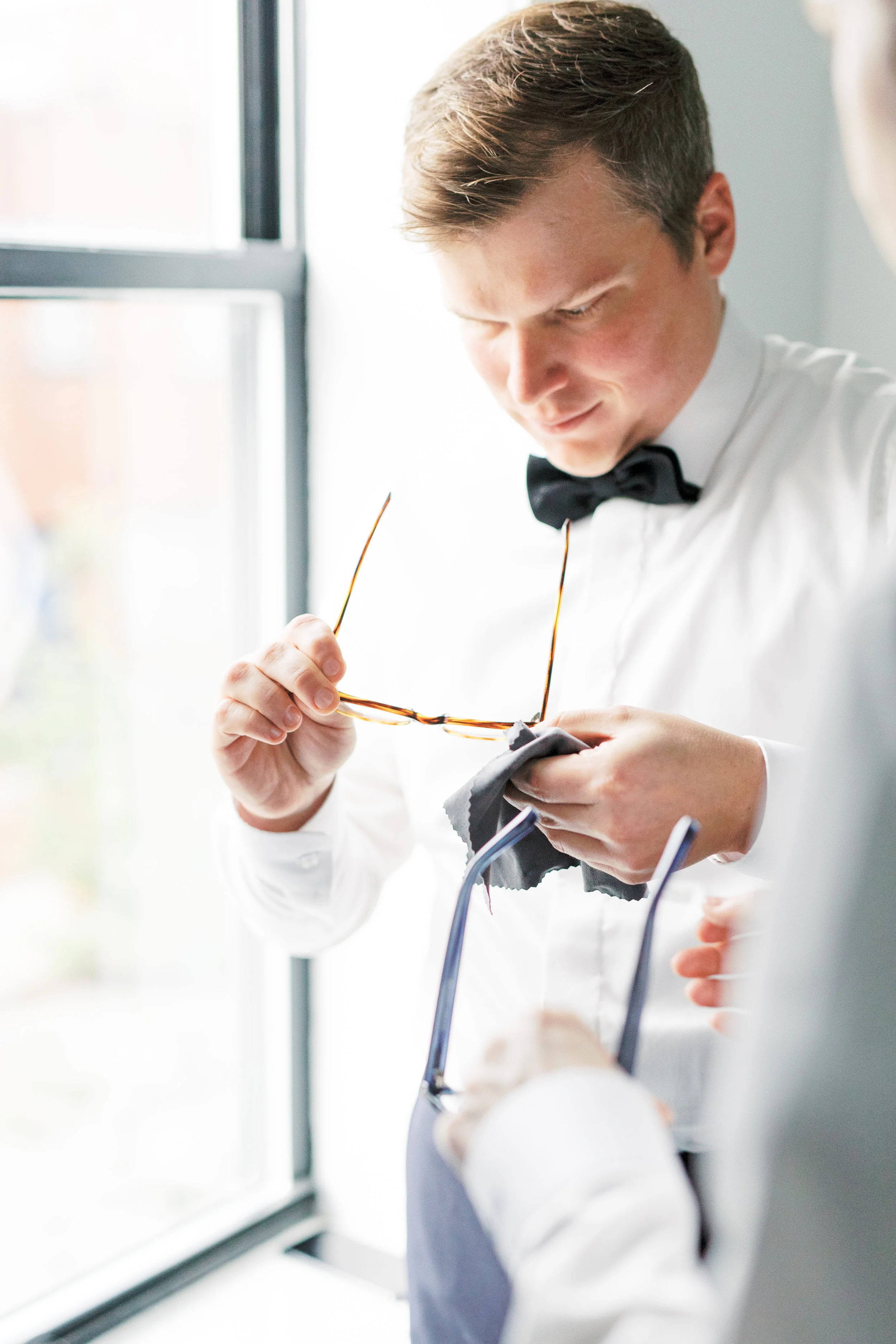 two grooms getting ready together on their Philadelphia wedding day