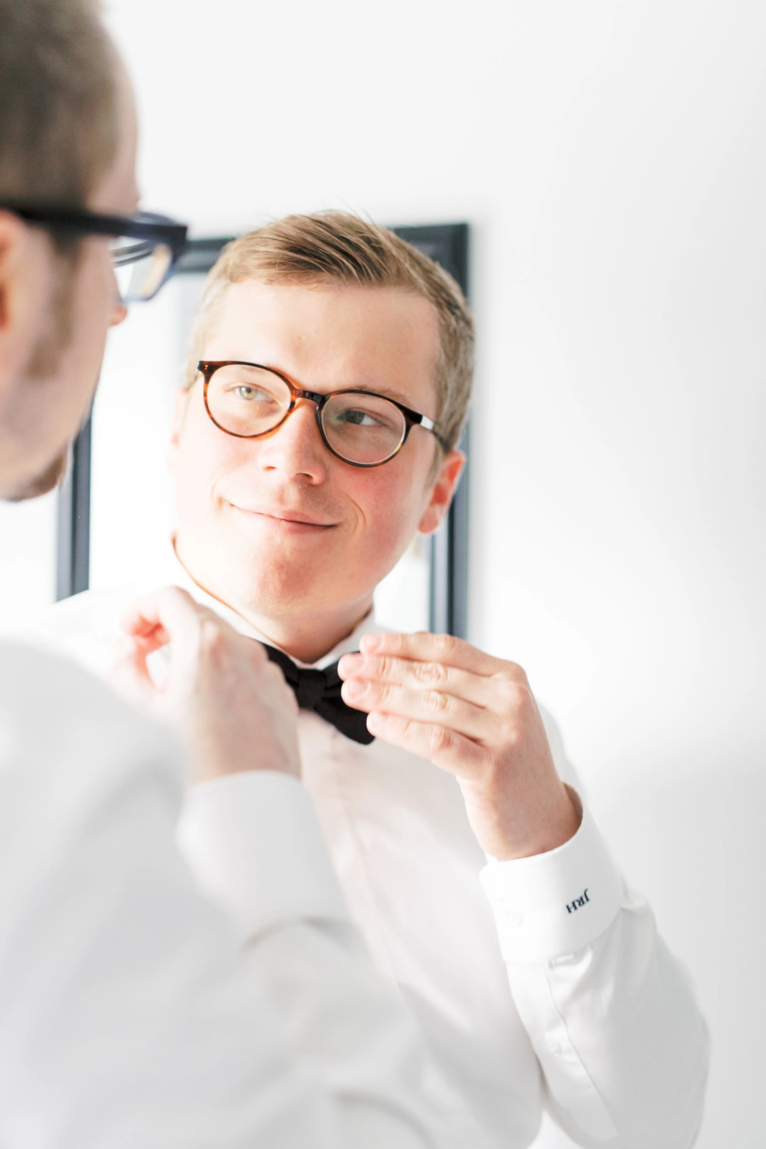 two grooms getting ready together on their Philadelphia wedding day