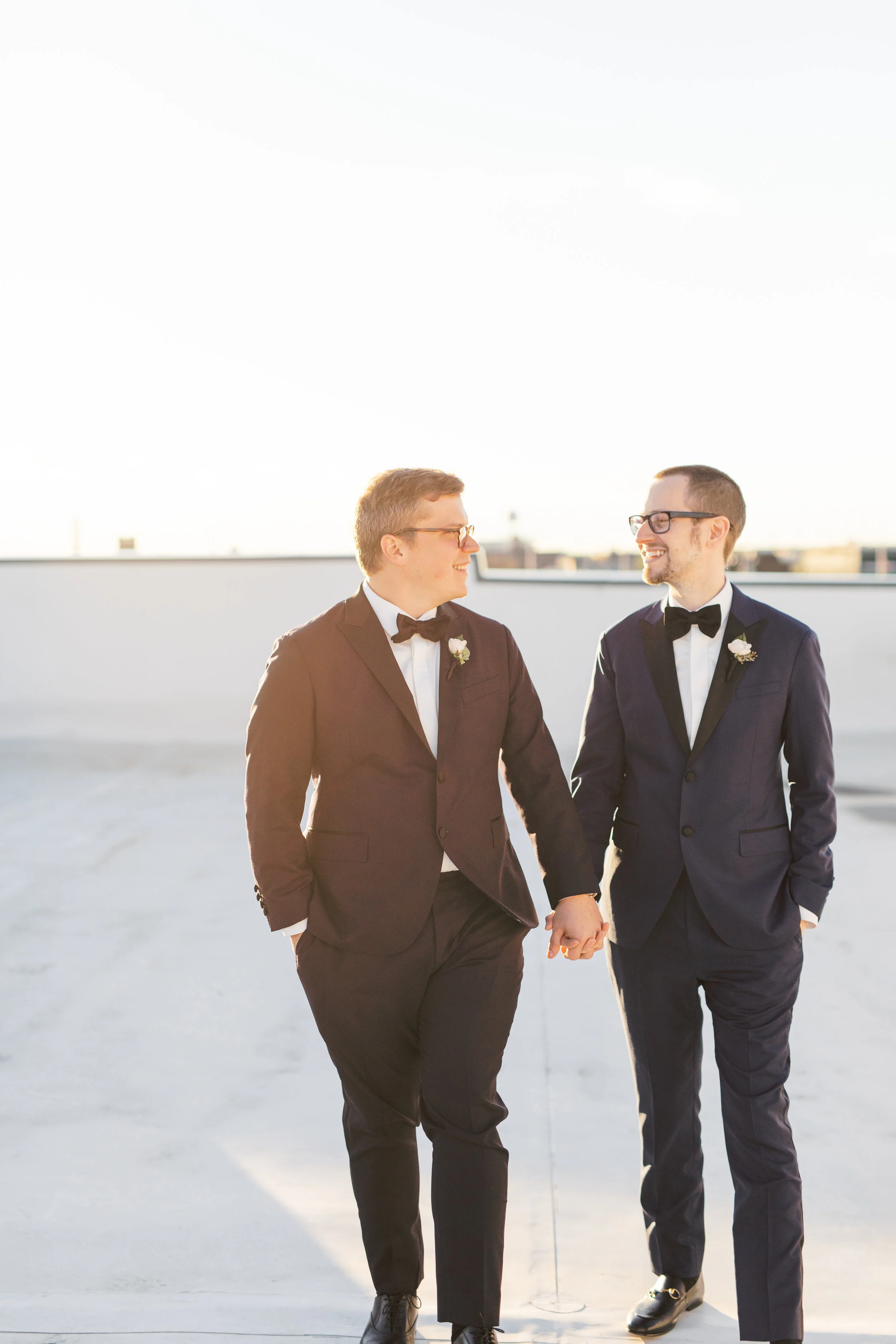 industrial and modern rooftop wedding venue, FAME, in Philadelphia with skyline view with two grooms