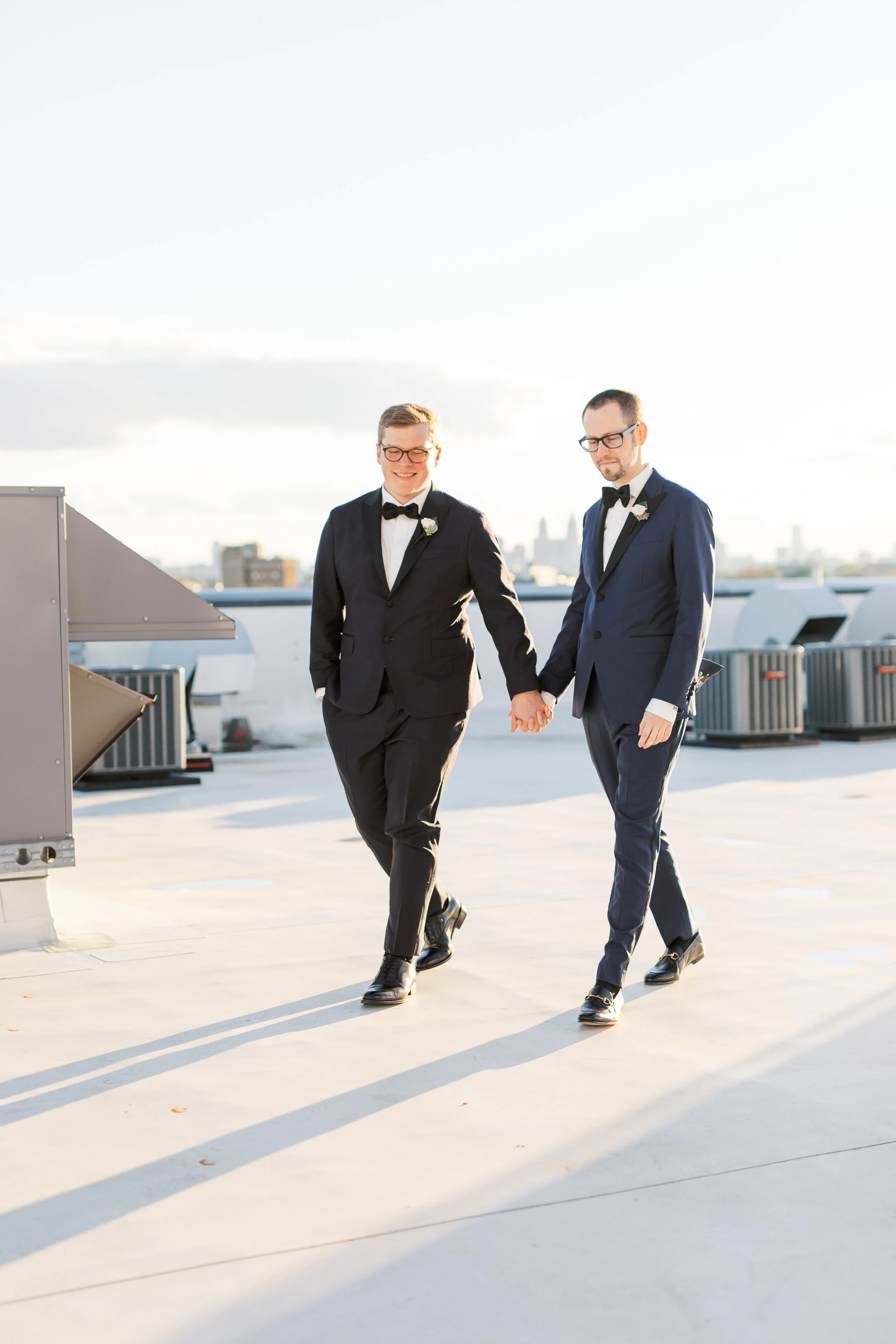 same sex wedding on a industrial and modern rooftop at FAME in Philadelphia with skyline view