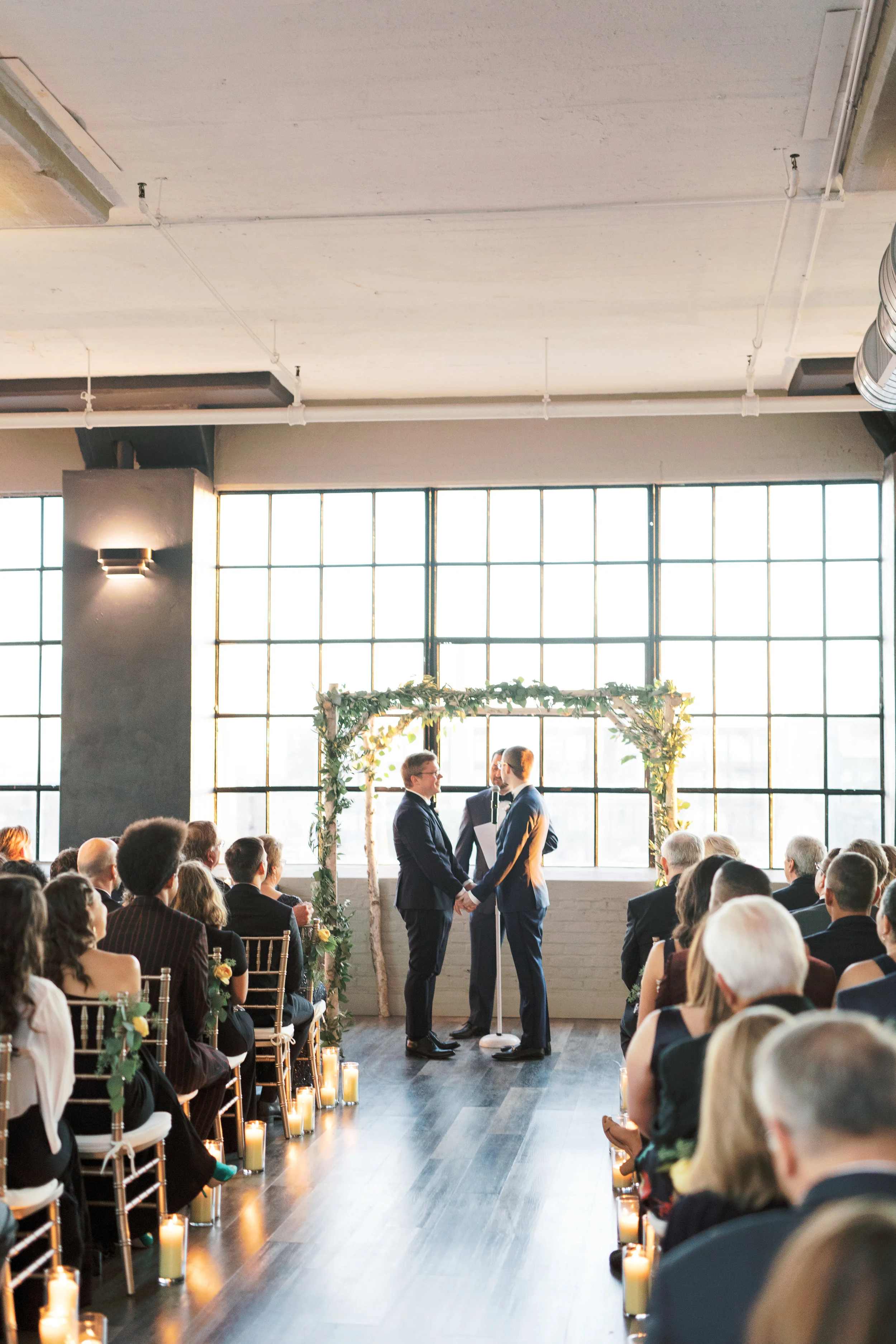 same sex wedding ceremony at FAME, industrial and modern warehouse Philadelphia wedding venue