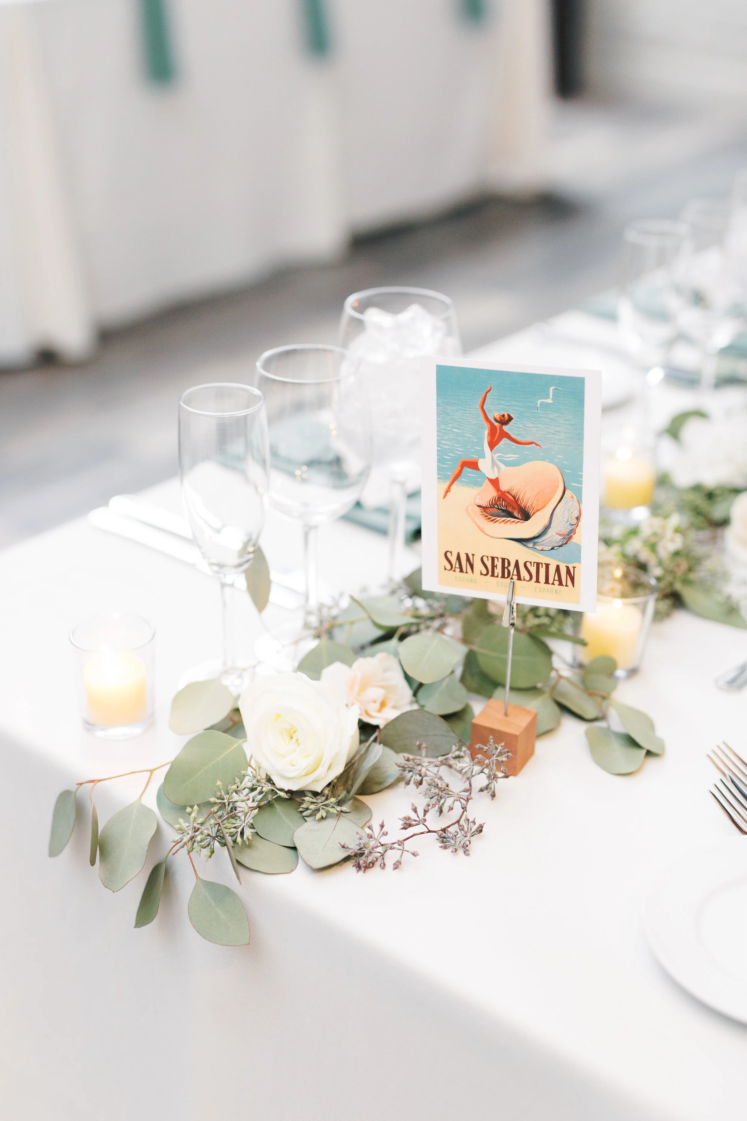 Reception setup at FAME, industrial and modern warehouse Philadelphia wedding venue by Haley Richter Photography with travel themed details