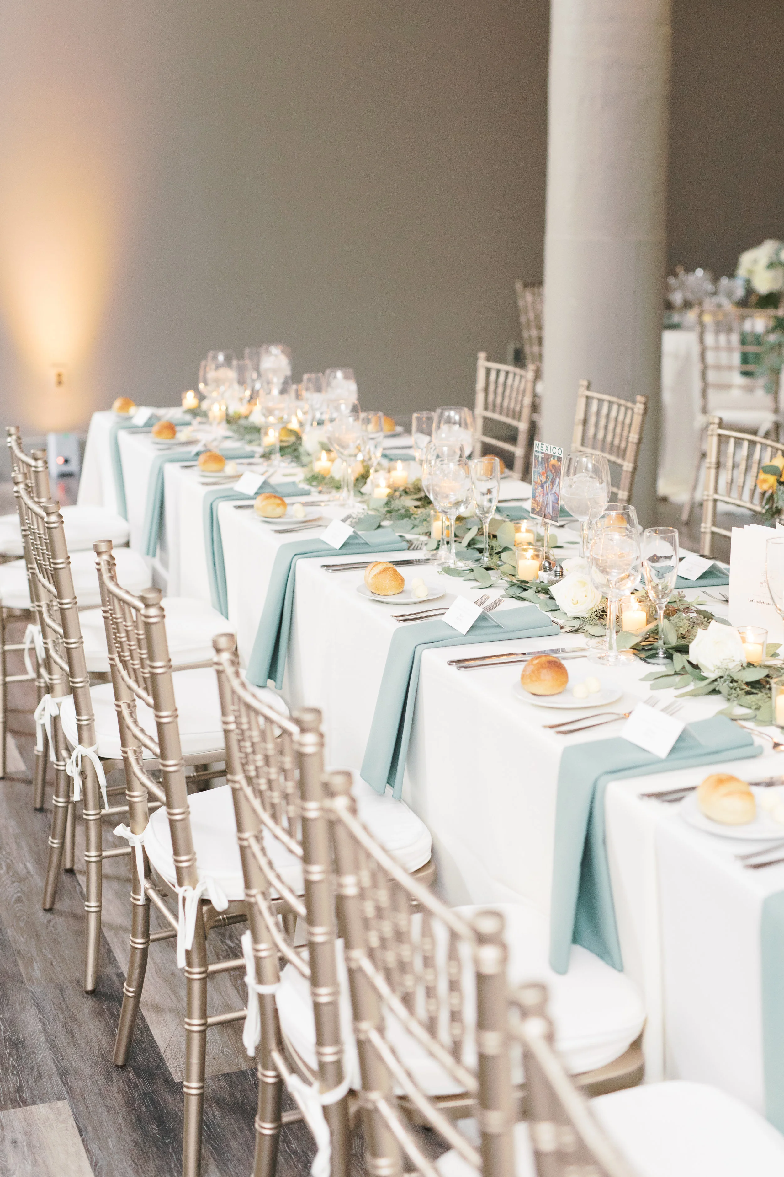 Travel themed reception details at FAME, industrial and modern warehouse Philadelphia wedding venue