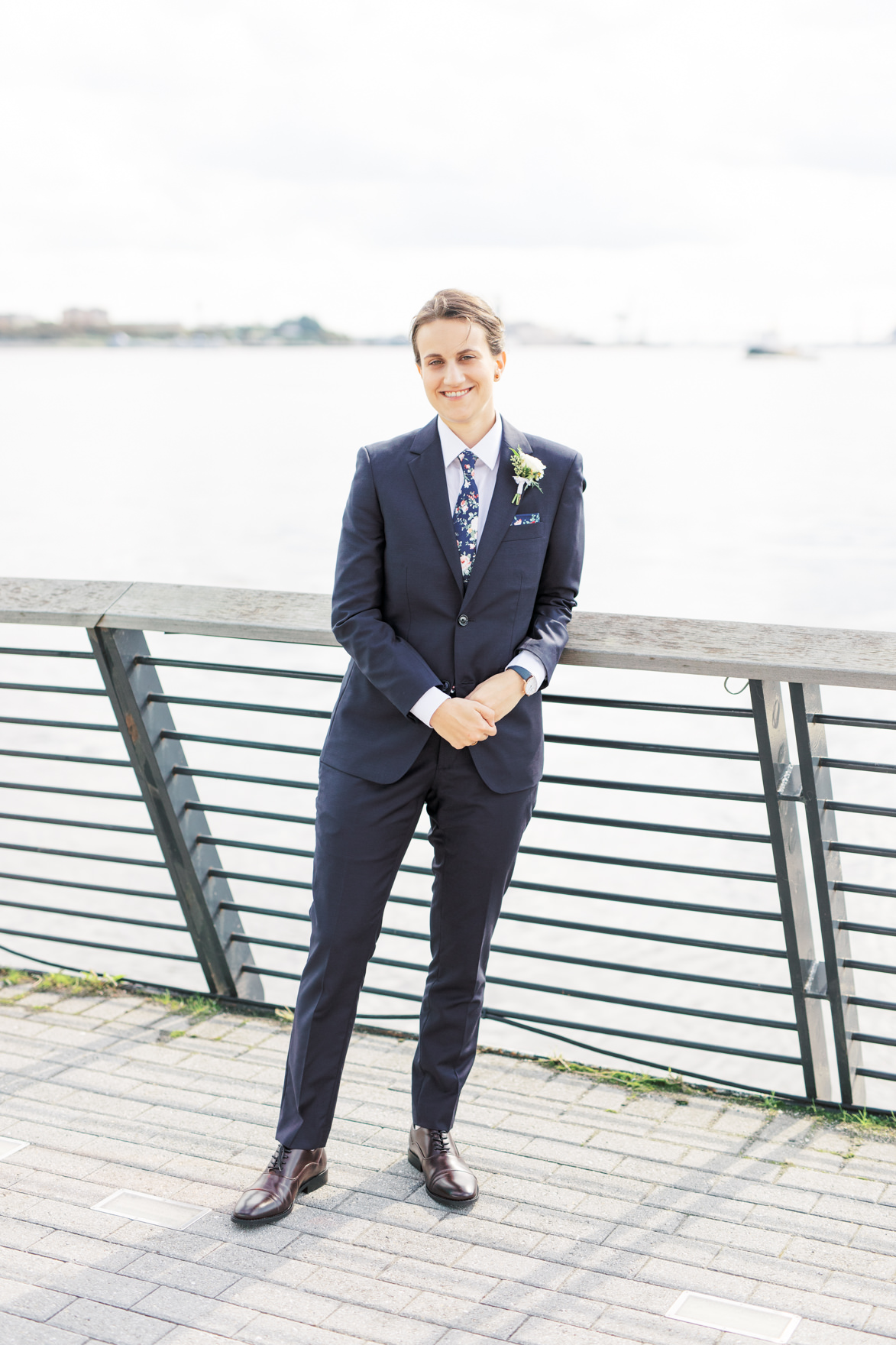 2018 was the year of blue suits, and we loved how Dani paired hers with a floral tie, adding a little bit of a twist for her modern and elegant old city Philadelphia Power Plant Productions wedding. Power Plant Production wedding photographer