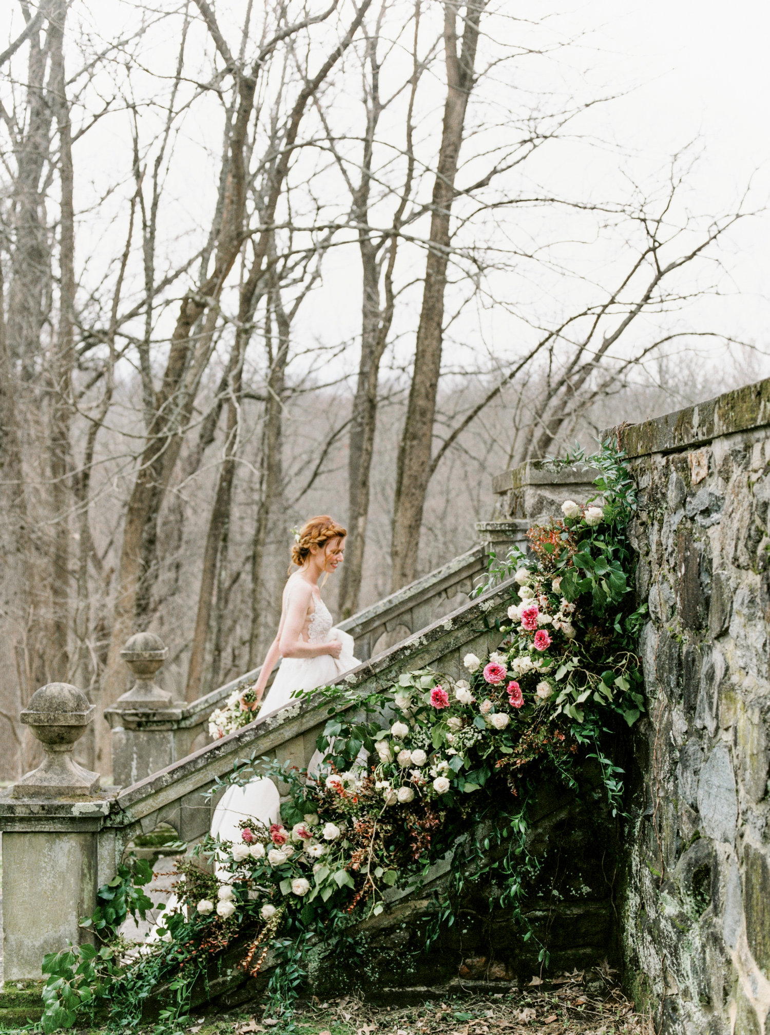 A fairytale wedding scene with trailing greenery on an old stone staircase. Top 20 Philadelphia wedding venues. Parque wedding photographer Ridley Creek