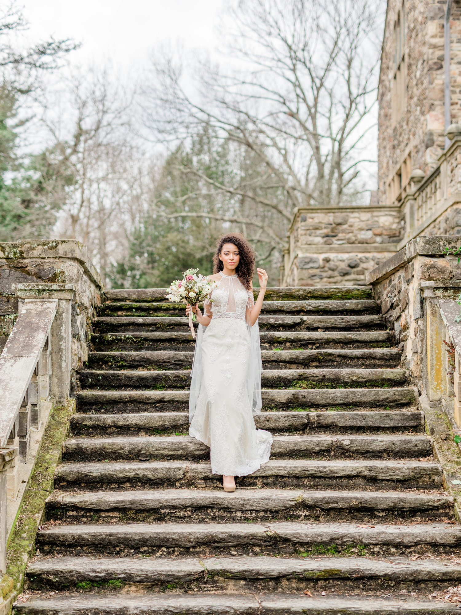 Liz looked like a queen descending this old stone staircase in her Christina Wu wedding gown. Top 20 Philadelphia wedding venues. Parque wedding photographer Ridley Creek