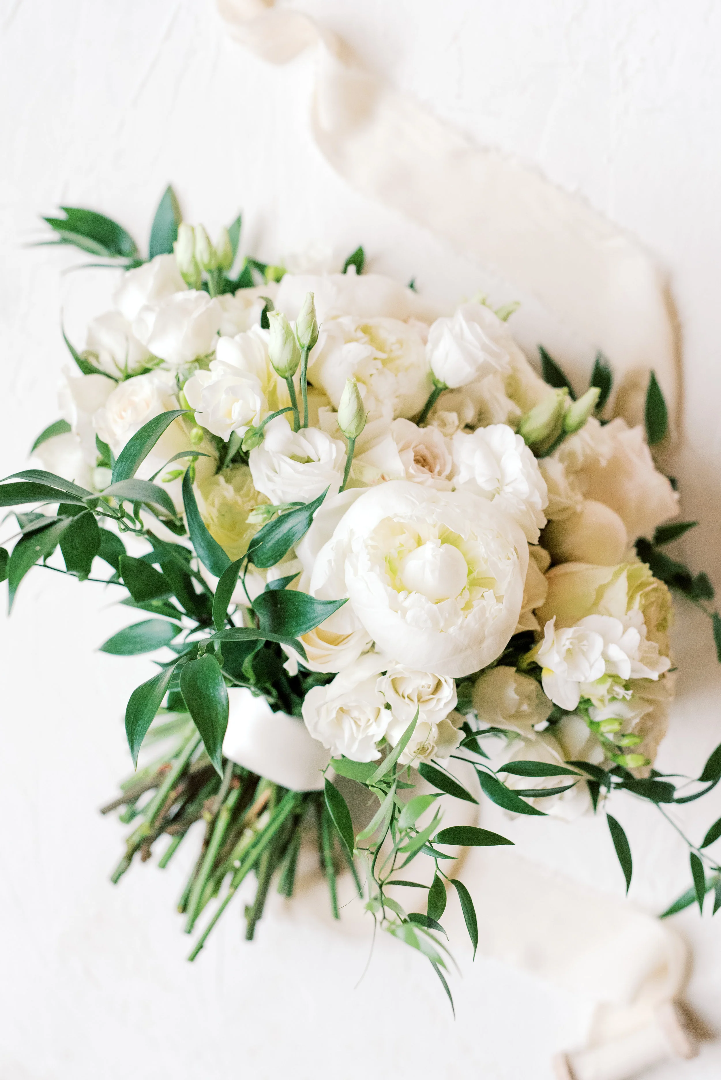 We love a classic white bouquet done exceptionally well, loose blooms are our favorite from this romantic and classic wedding day for their french inspired green and white Cairnwood Estate wedding.