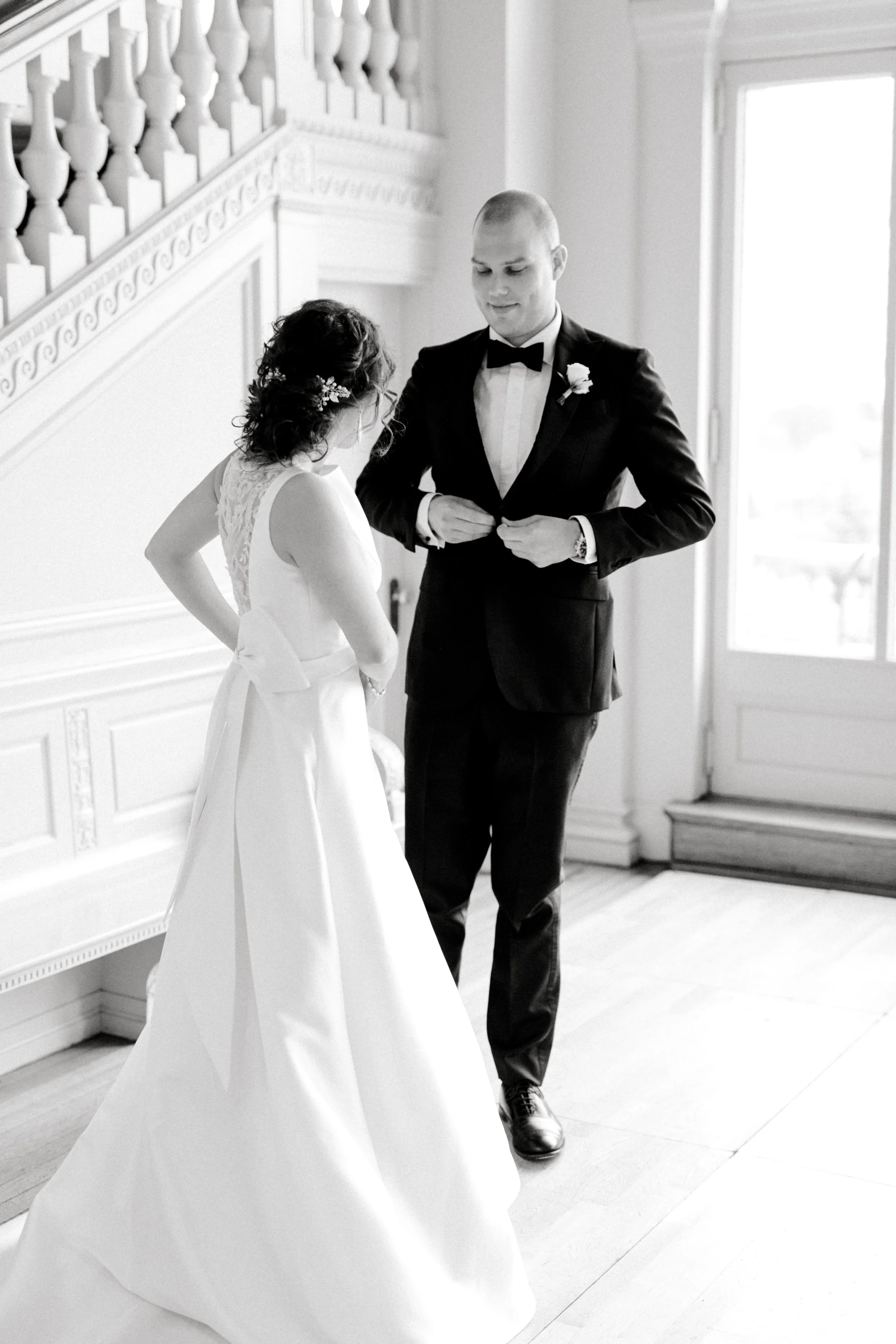Our bride and groom say hello at their first look for their romantic and classic wedding day for their french inspired green and white Cairnwood Estate wedding