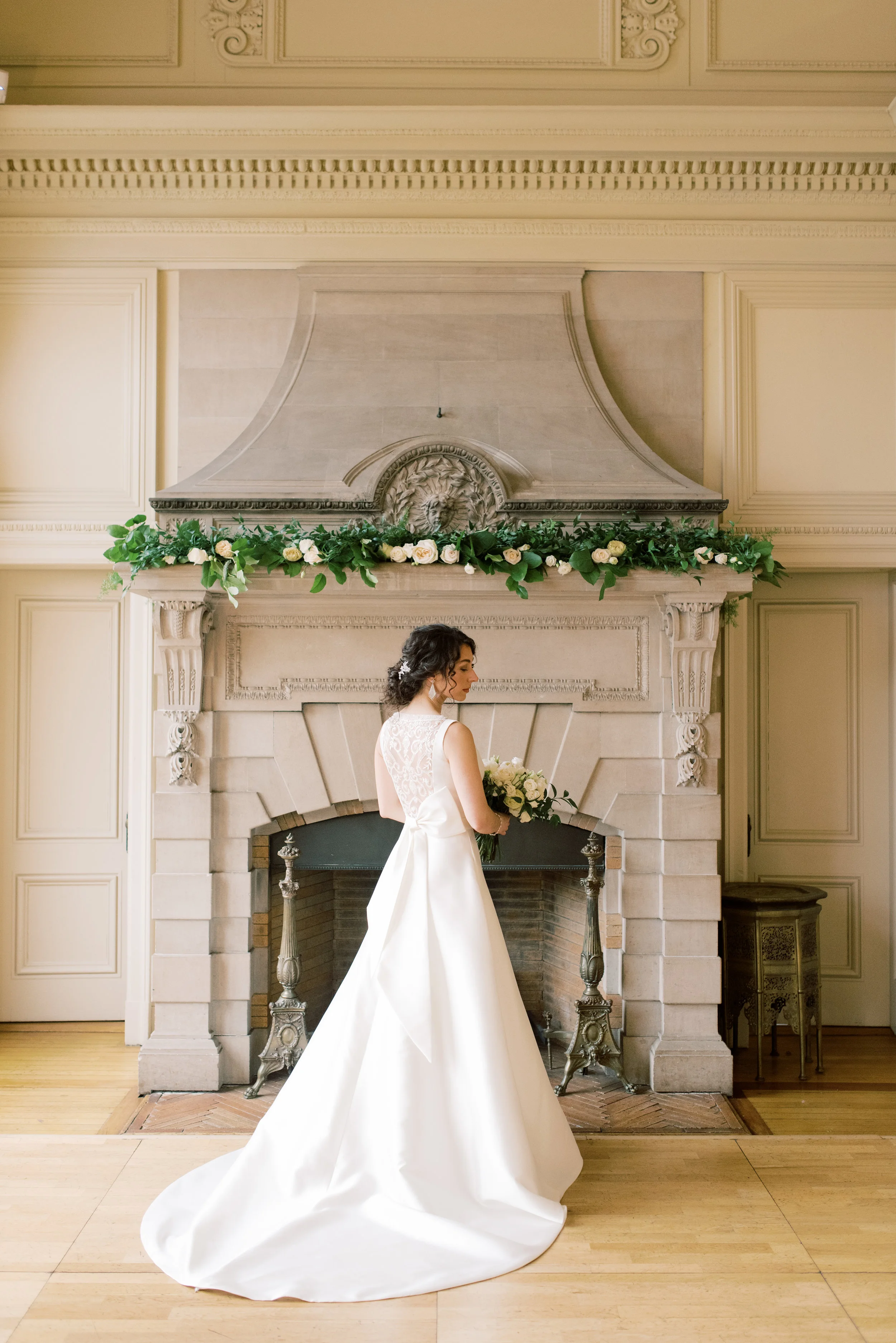 We simply adored the modern asymmetrical bow on the back of this structured a-line wedding gown from this romantic and classic wedding day for their french inspired green and white Cairnwood Estate wedding