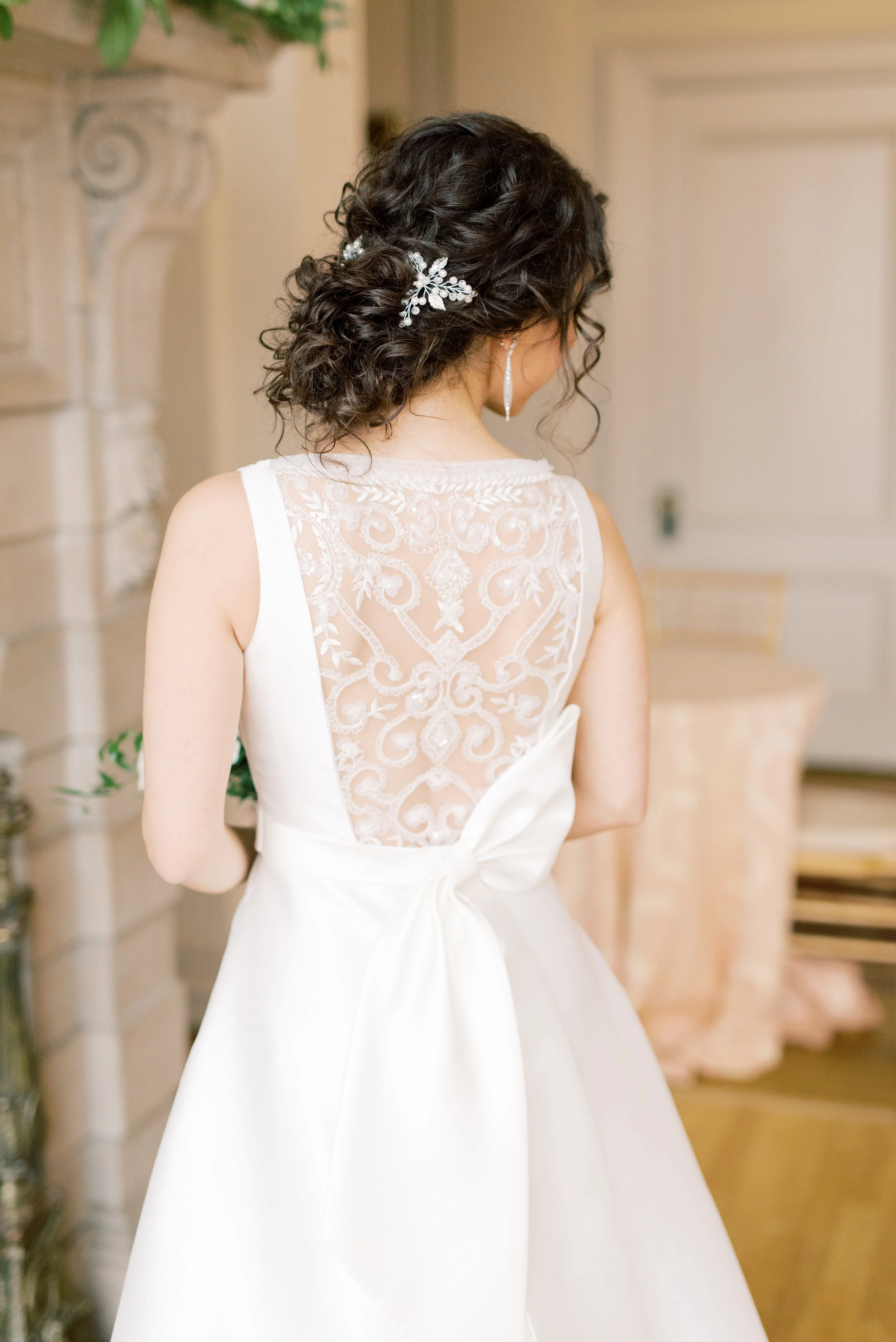 The lace back and modern asymmetrical bow on this wedding gown were flawless from this romantic and classic wedding day for their french inspired green and white Cairnwood Estate wedding