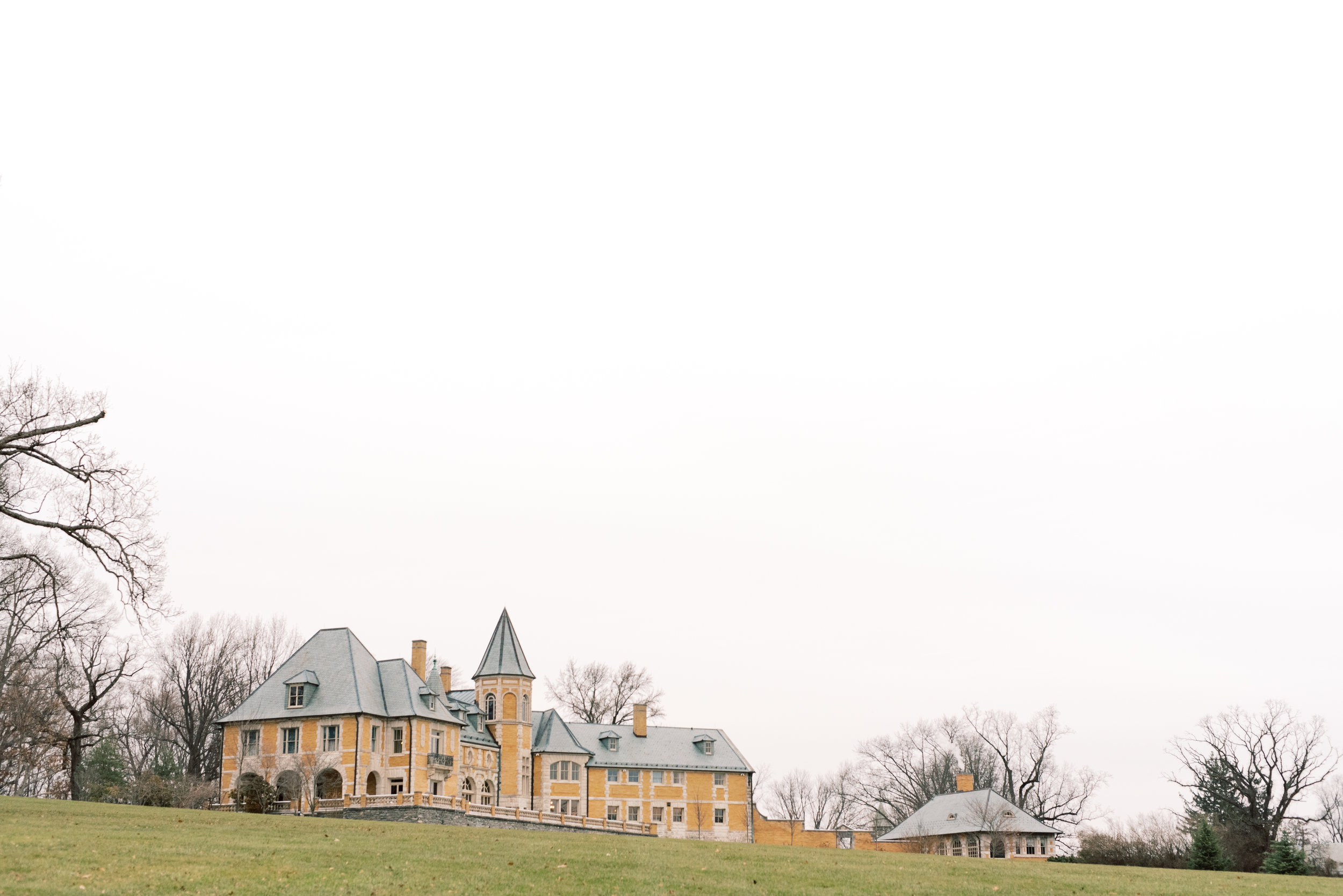 The beautiful french architecture has an old world feel from this romantic and classic wedding day for their french inspired green and white Cairnwood Estate wedding