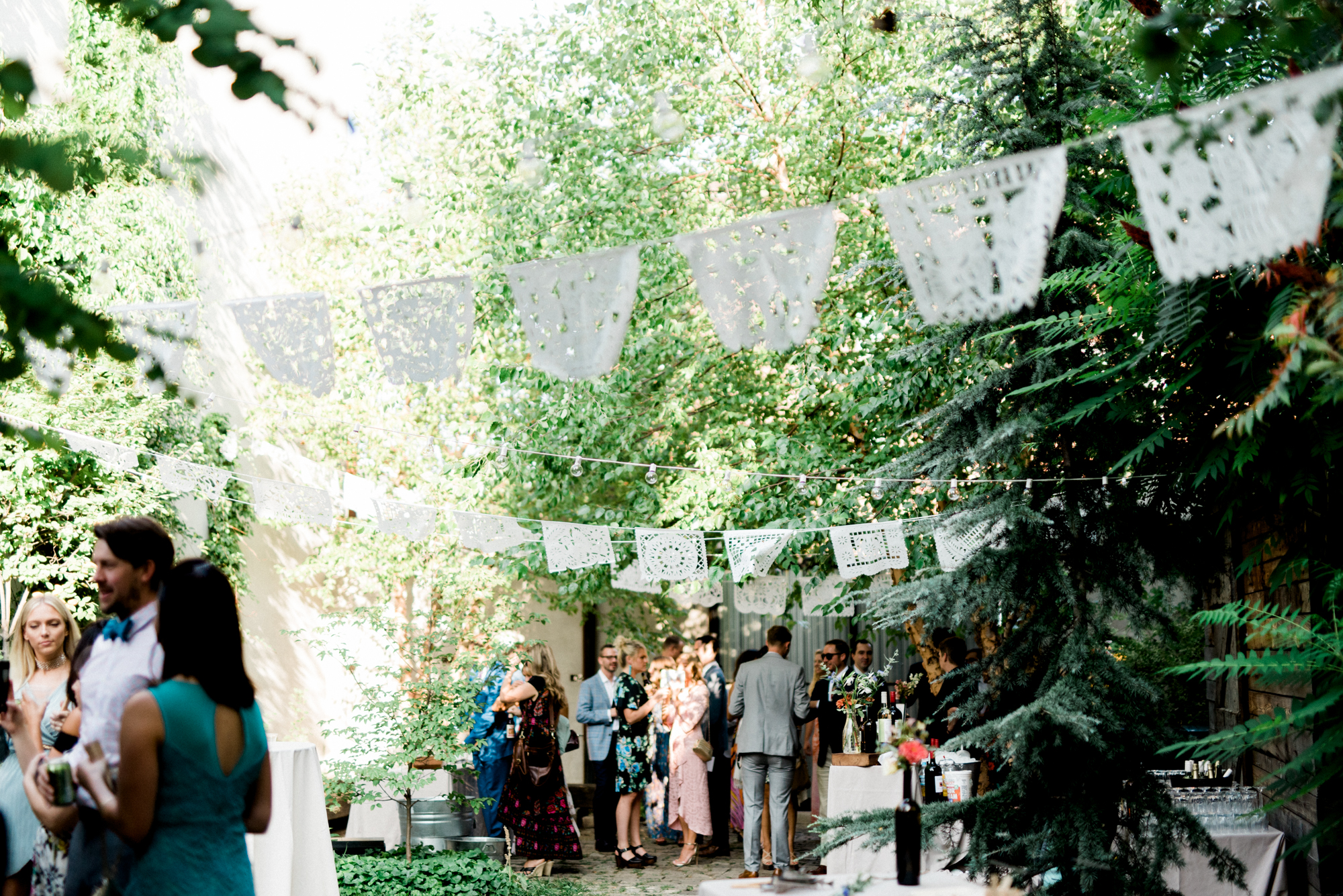 The canopy of trees in the quant and cool garden wedding venue in Philadelphia is giving us all the feels. We love this little oasis in the city for a modern couple wanting to get married in a cool space. Maas Building wedding photographer.