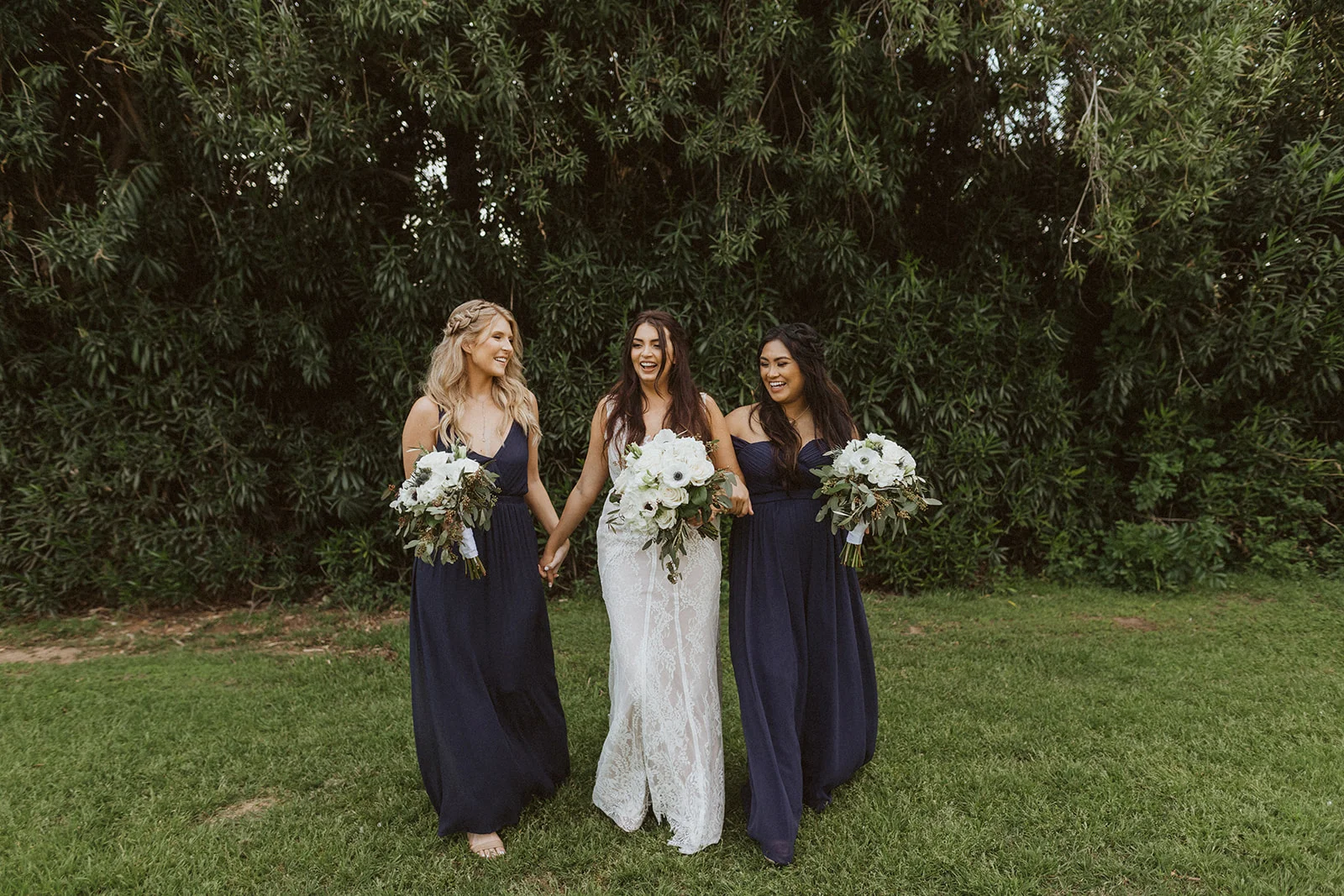 bridesmaids_and_bride_laughing.jpeg