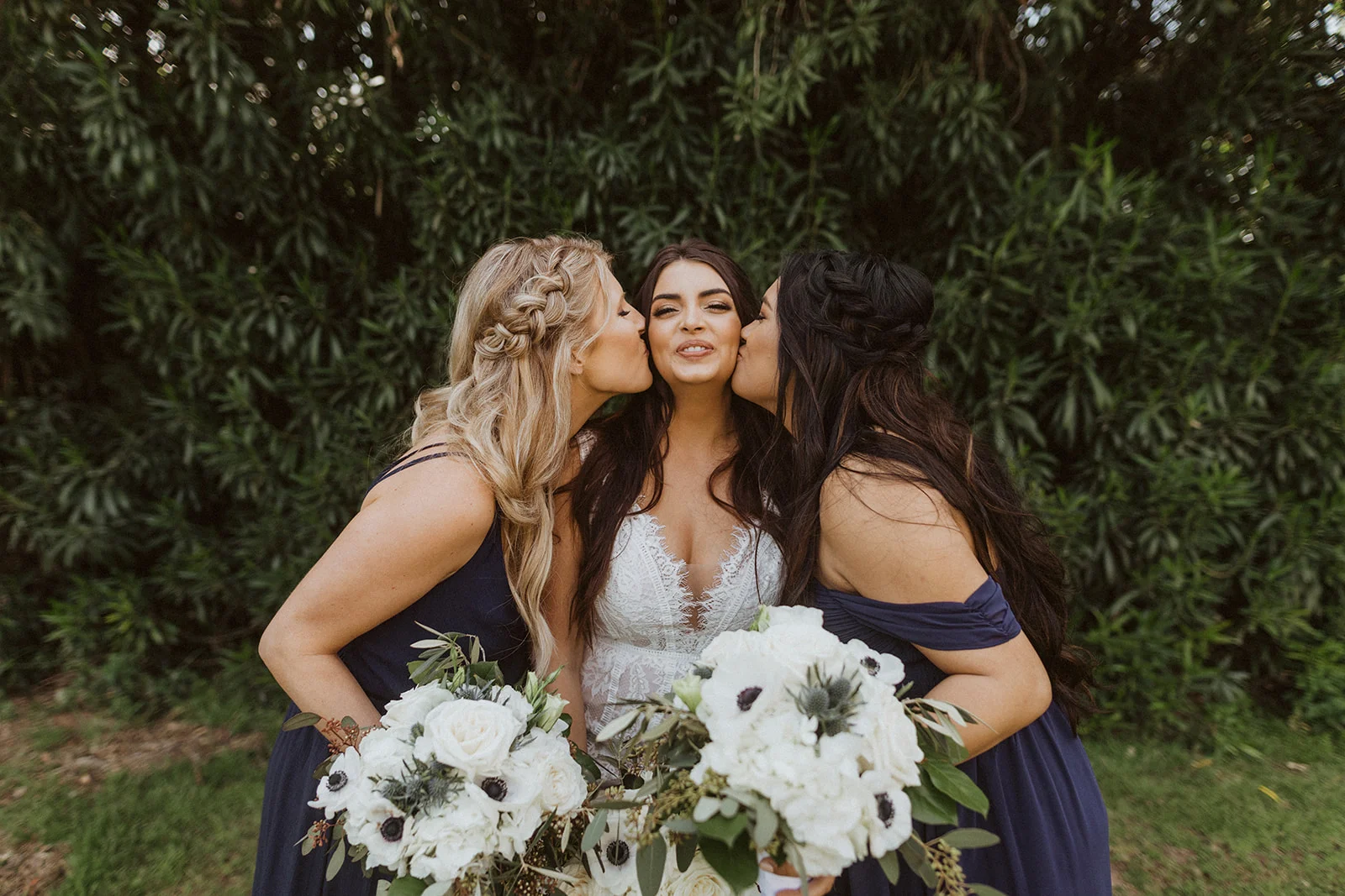 bridesmaids_kissing_bride.jpeg