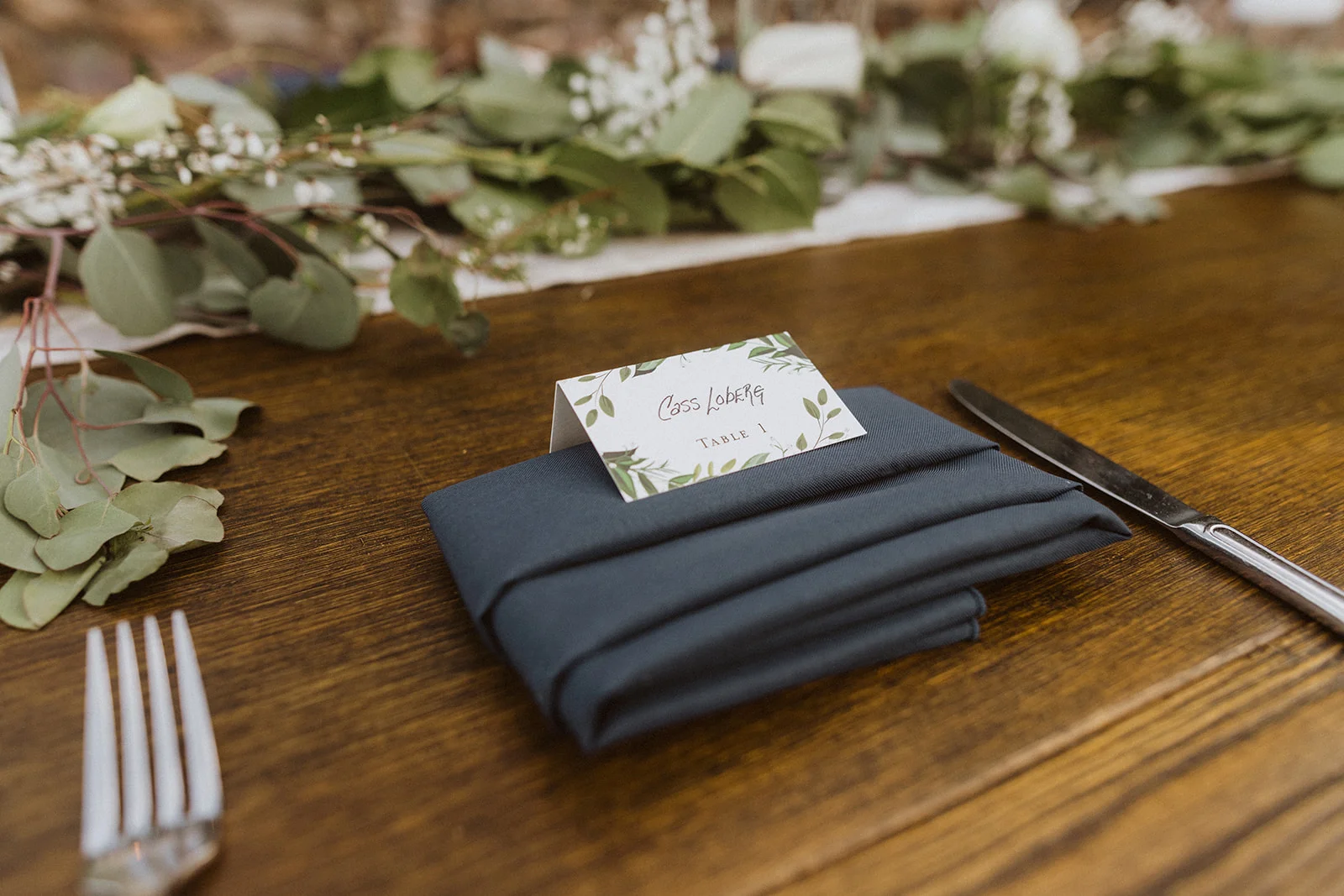 table_setting_with_navy_napkin.jpeg