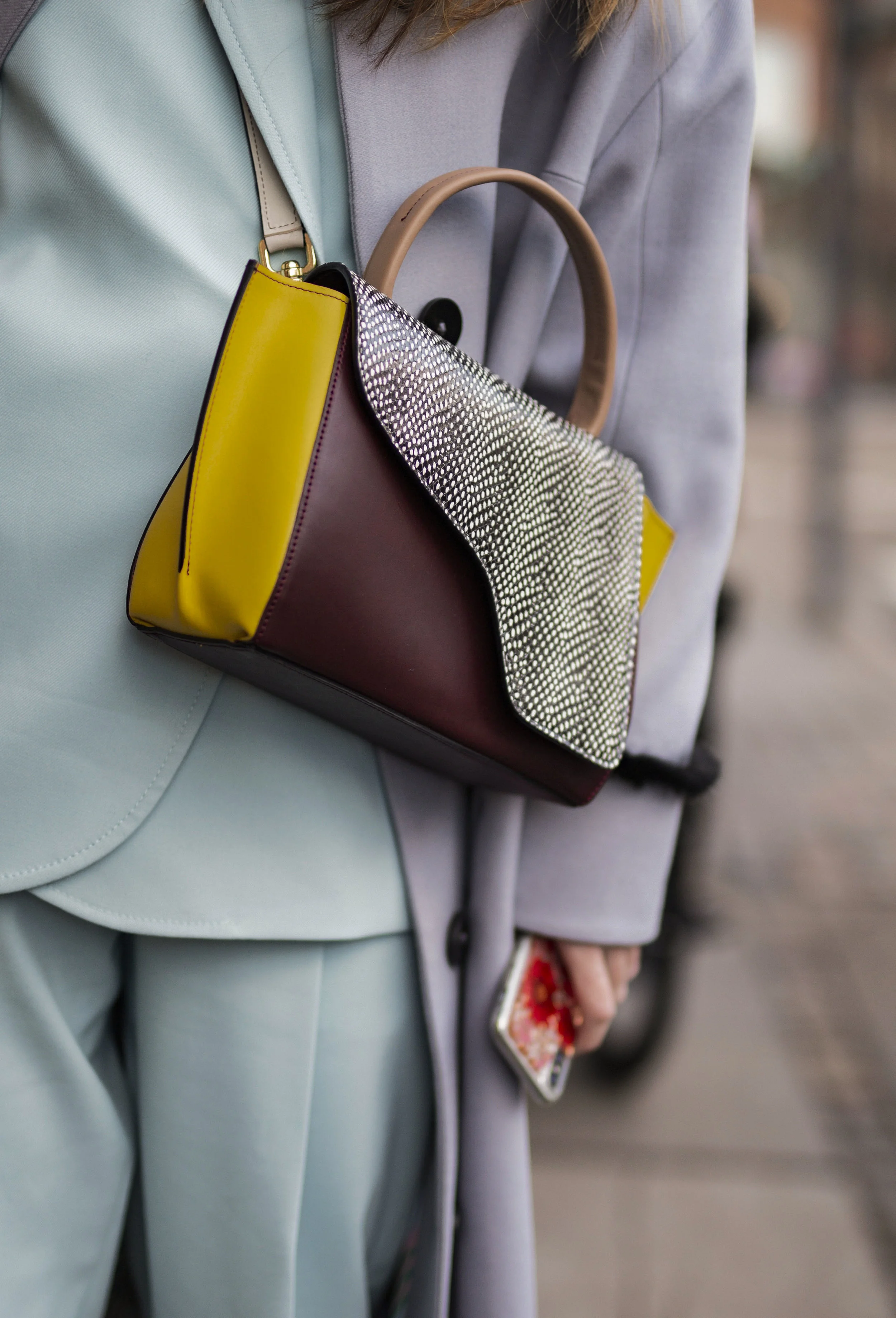 Alberte Whitta whith her detail handbag on the streets of Copenhagen during Fashion Week Streetstyle