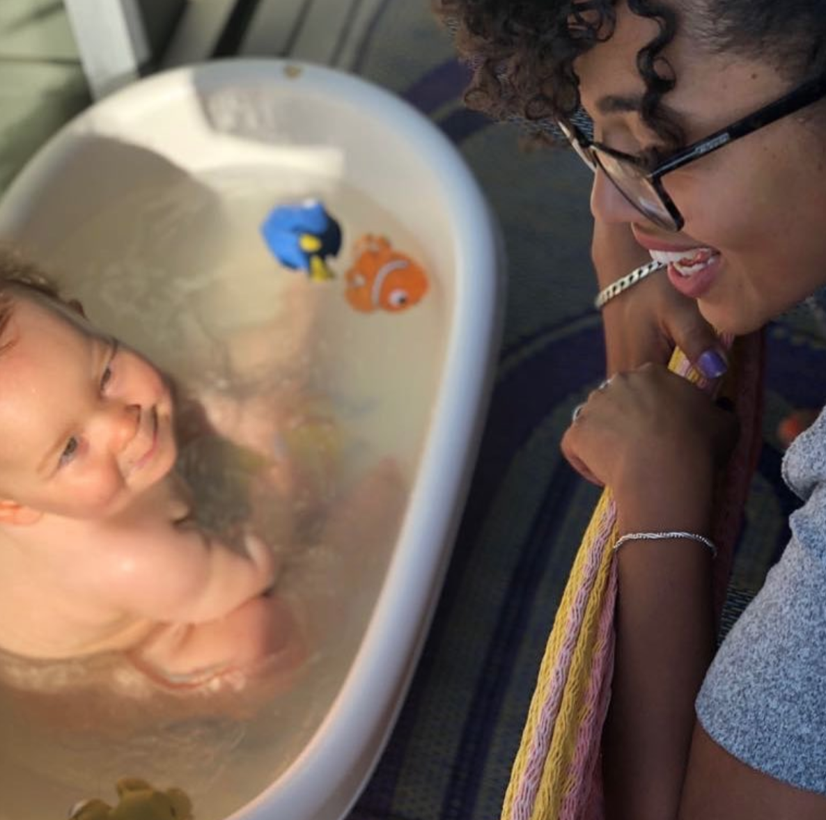Opokua Britton-Cavaco, one-half of Skin Gourmet Sweden, bathing her daughter, Irie, with African Black Soap. Courtesy of Skin Gourmet Sweden .