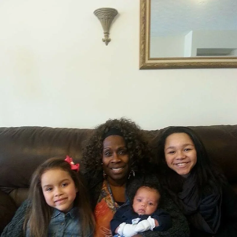 Cheryl Abrams with 2 children who she helped doing sibling doula duties