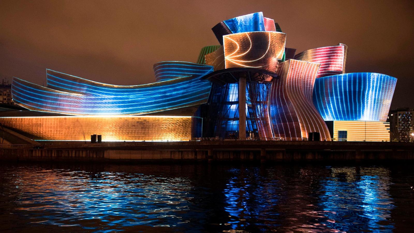 The Guggenheim Bilbao at night, photo from Ander Gillenea via Chicago Tribune