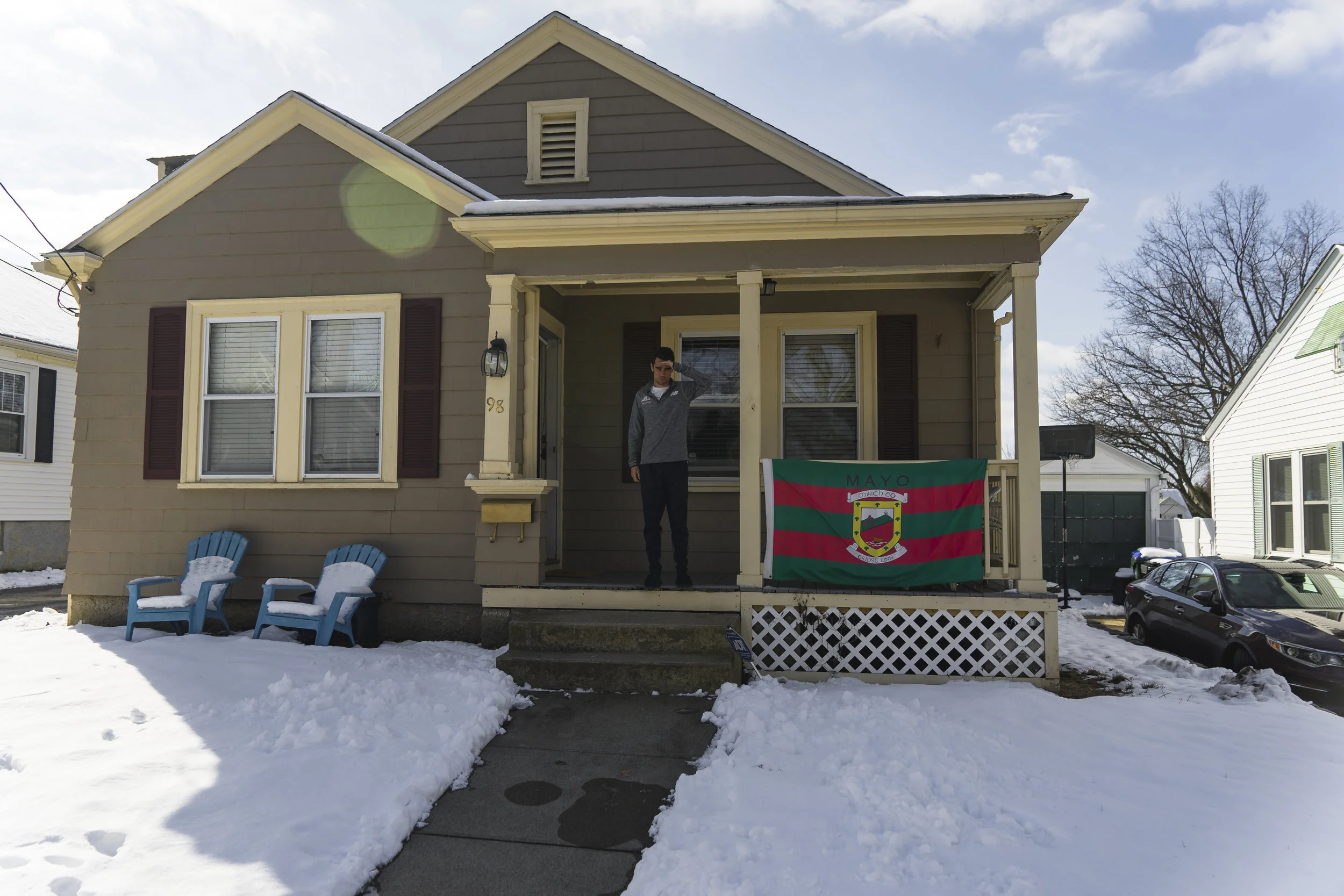 Clad in slippers and sweats, Julian welcomes us to his humble abode. 