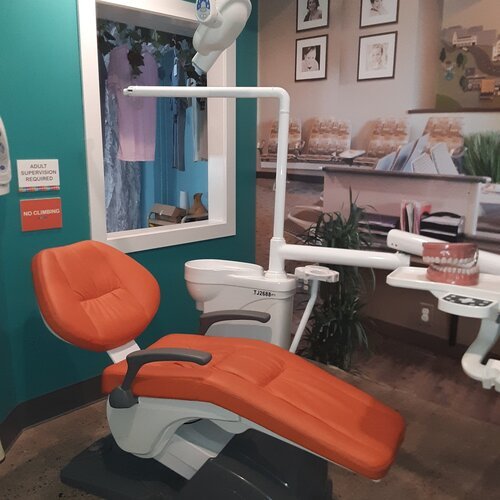  The dentist's office is in a smaller room that can become crowded easily. The children are able to sit in a real dentist's chair and also play and look at a life-like set of teeth. There is also an x-ray machine they can use to look at teeth. Since 