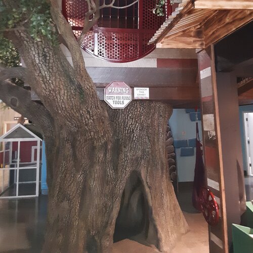  The treehouse consists of two parts, the upper level, and the lower level. To find the upper level, the children need to pass through another exhibit. It has windows for the children to look down at, and a slide that leads to the main Museum area. T