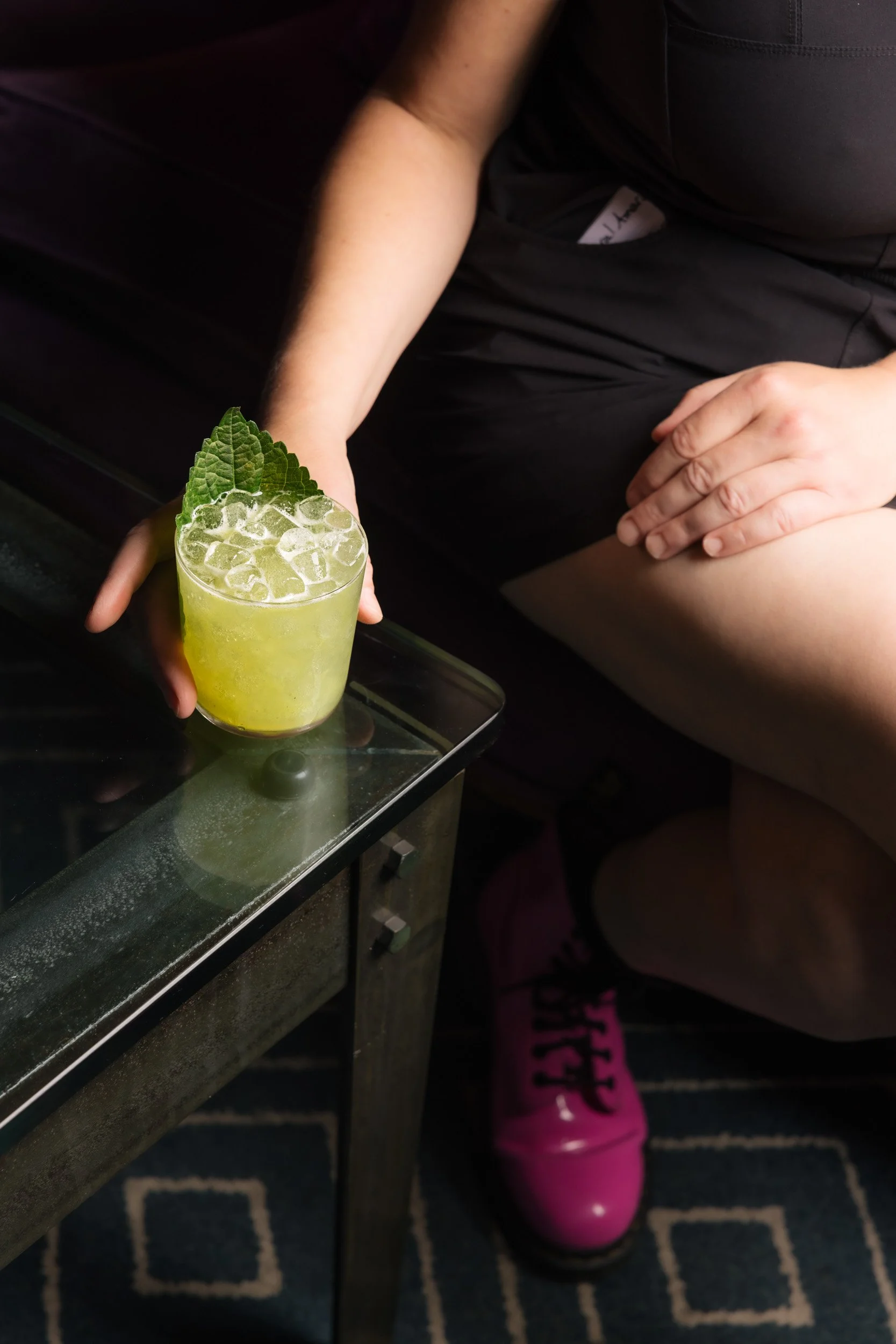 server holding green drink.jpg