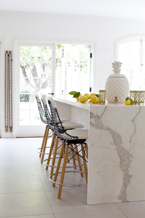 design & photo: reference link … there was the definite option of going with a super sleek, low on character stool here… but this unique choice ramps the space up dramatically even beyond that glorious waterfall.
