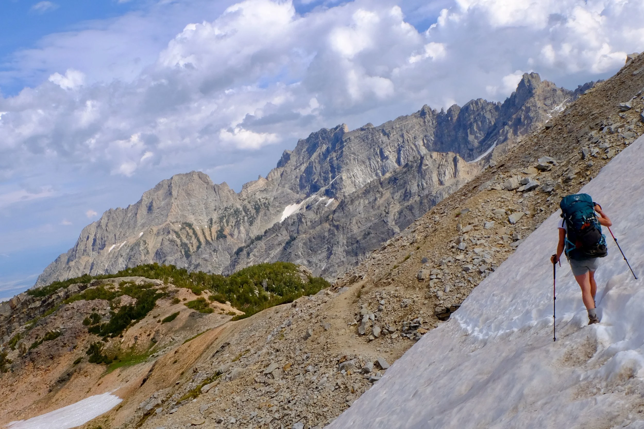 Sara traversing late summer snow in the Paintbrush Canyon