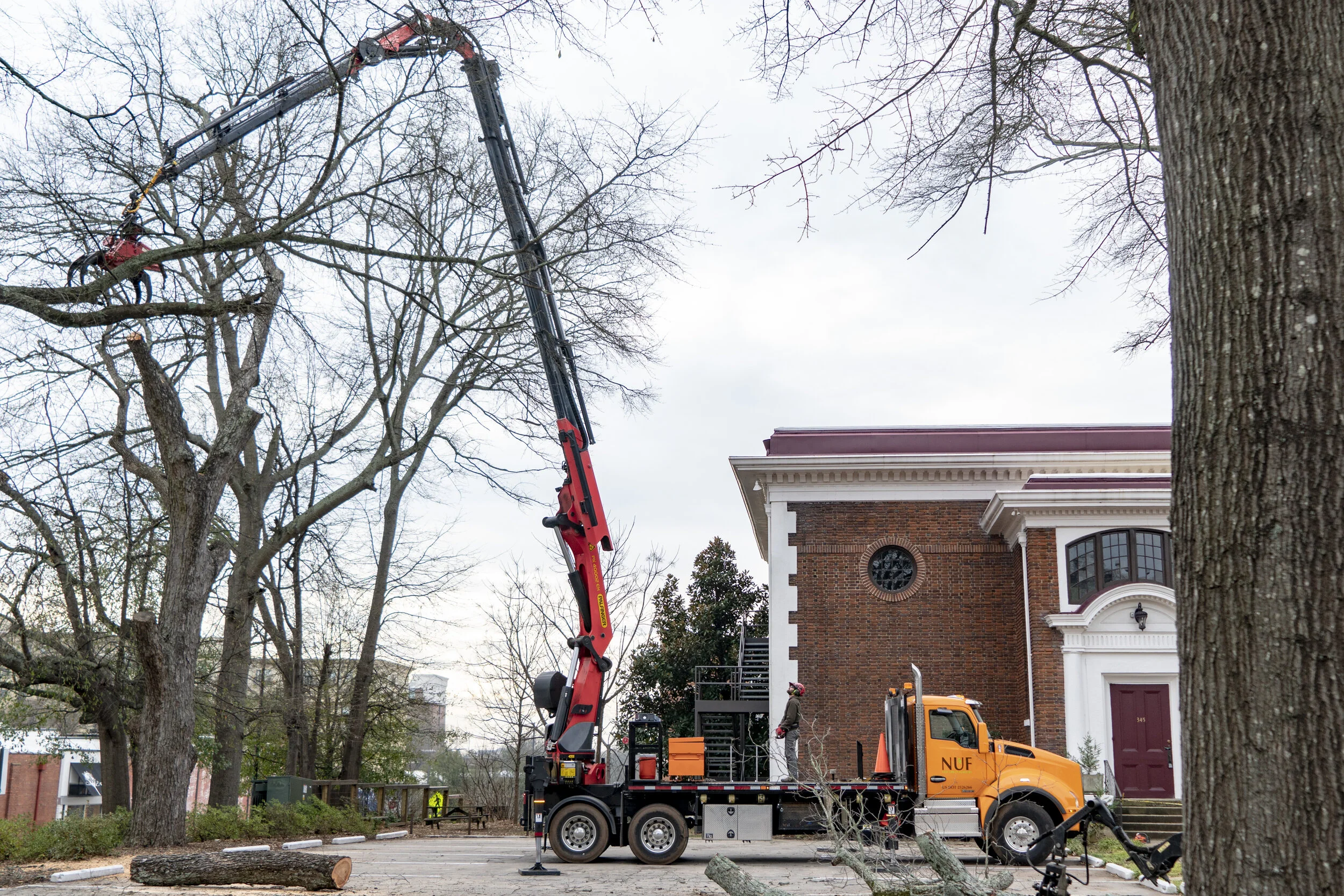 Our grapple crane is the safest, most affordable means of removing high risk trees.