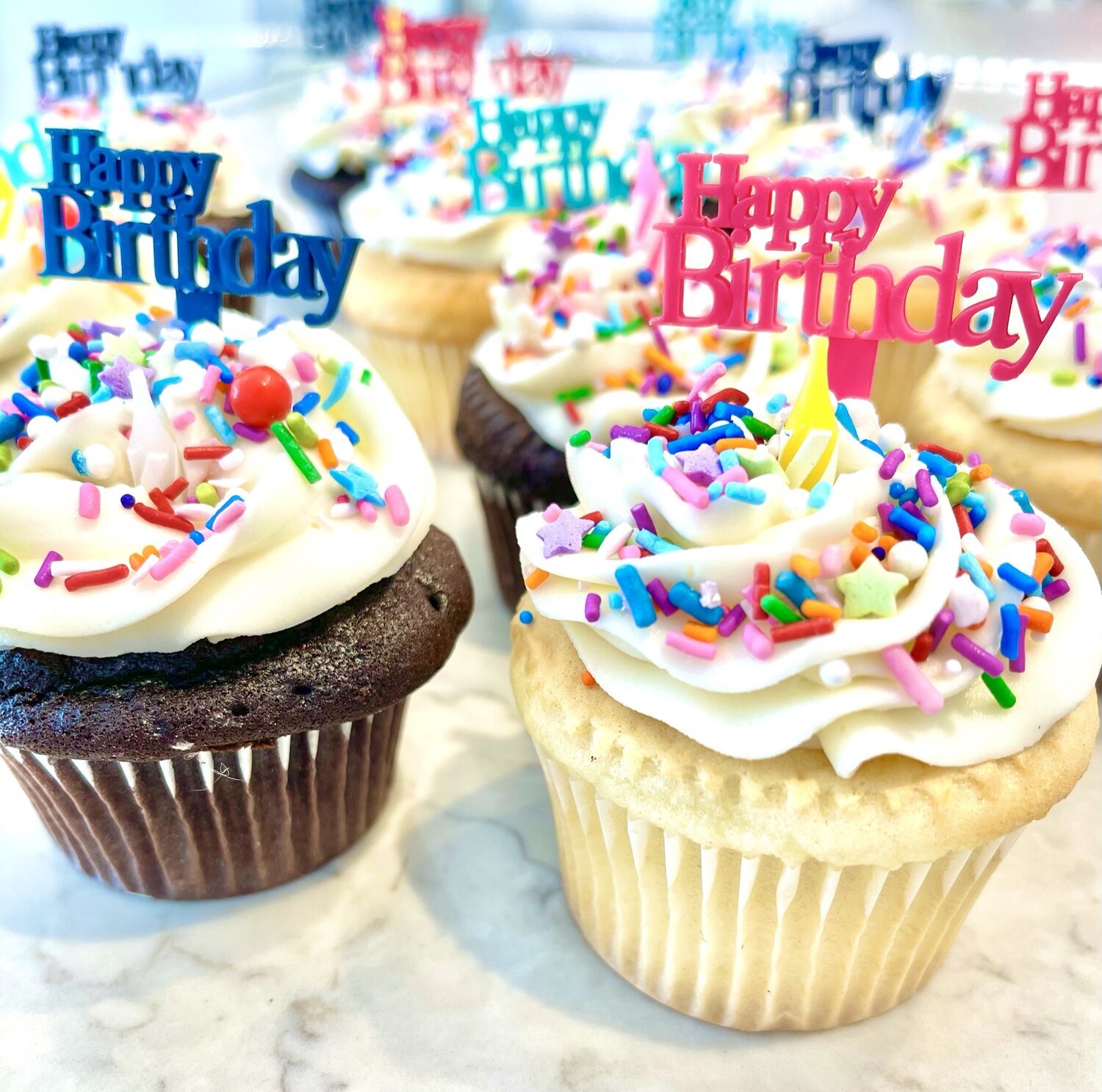 Celebratory cupcakes with colorful sprinkles and 