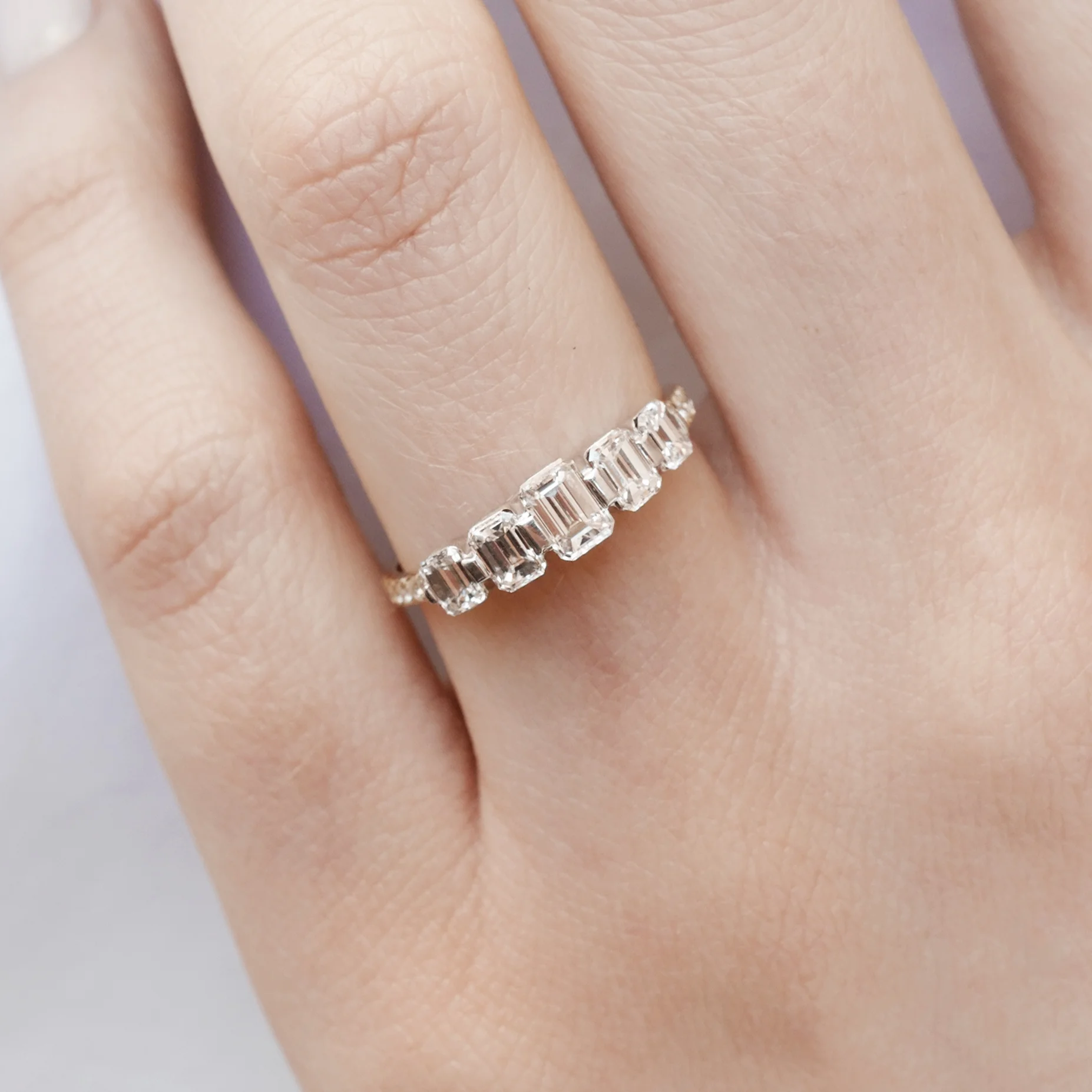 graduating emerald cut diamonds ring