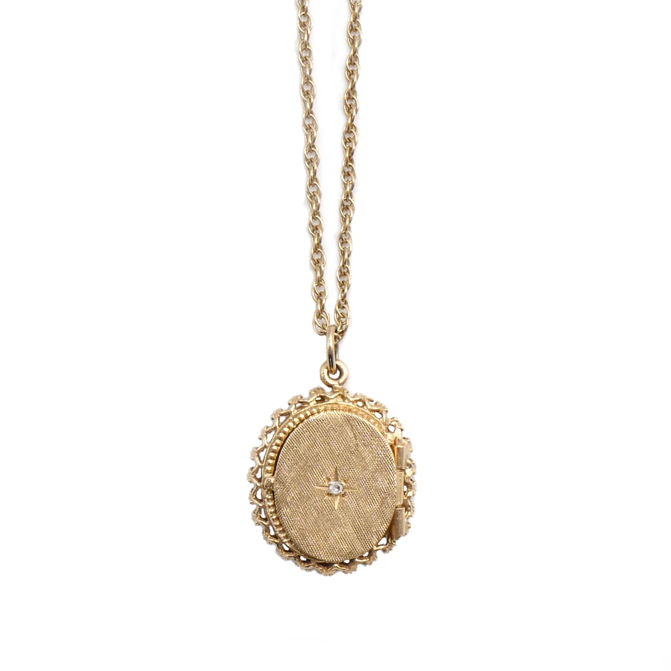 classic yellow gold Victorian Era locket with diamond star