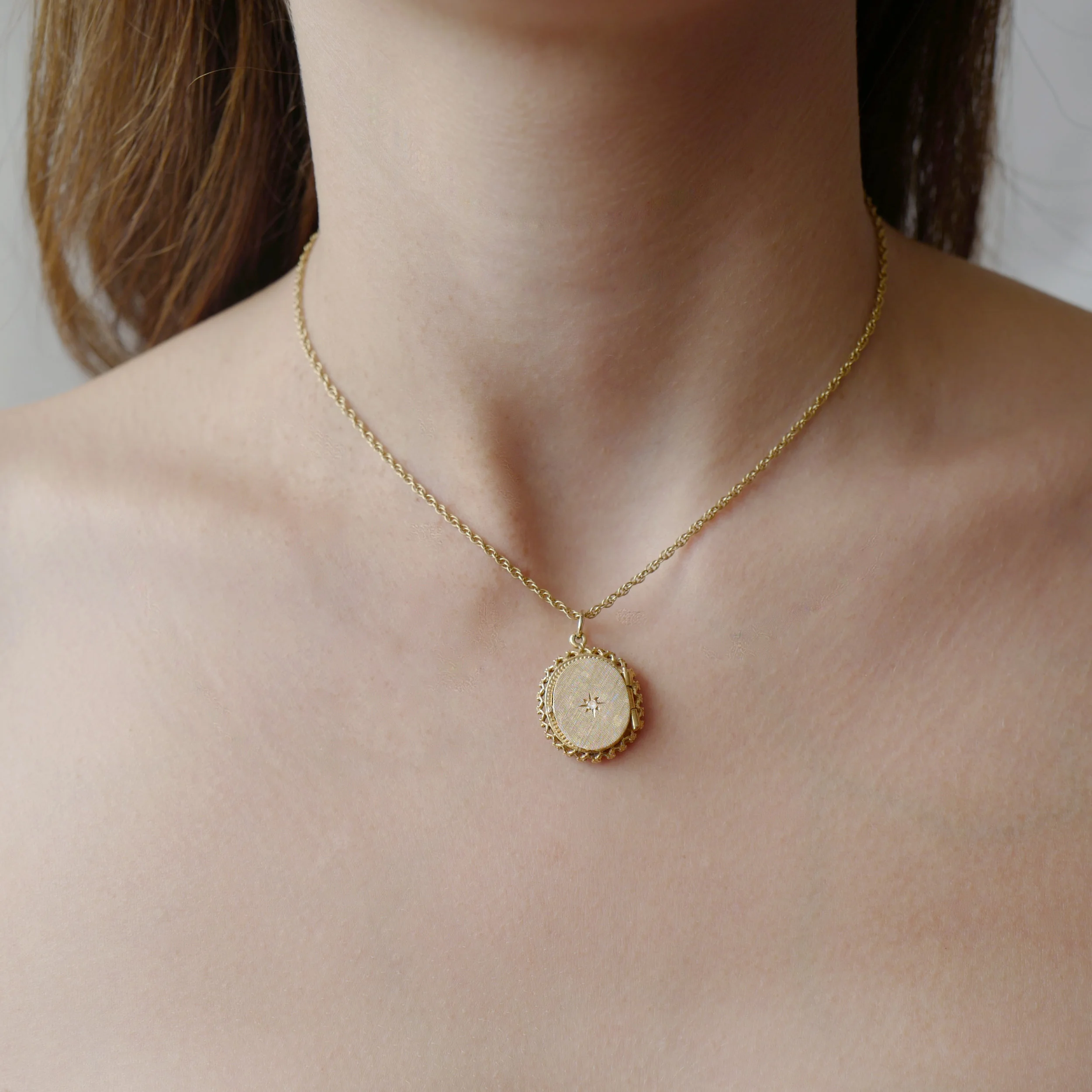 classic yellow gold Victorian Era locket with diamond star