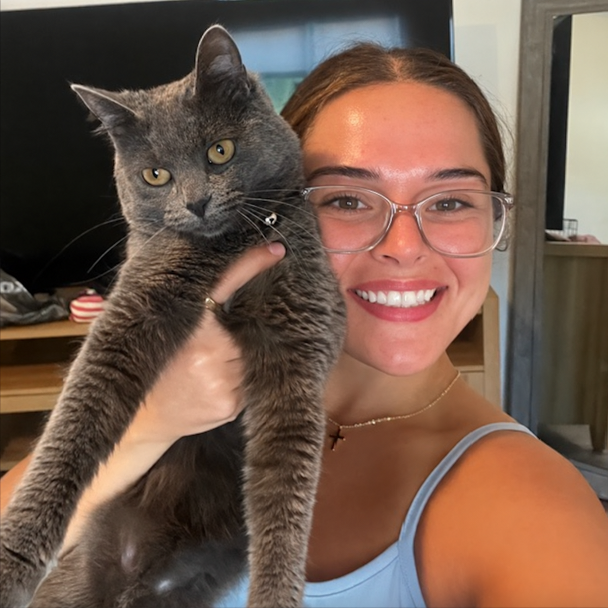 Chloe, veterinary assistant at Port Orchard Animal Clinic in Port Orchard, Washington, holding her cat Olive.