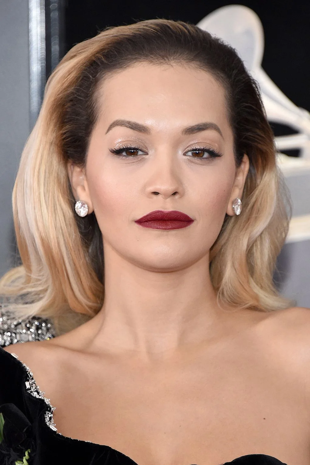 Rita Ora bare eyes gloss eye lid red vampy lipstick makeup Grammy Ceremony 2018 .jpg