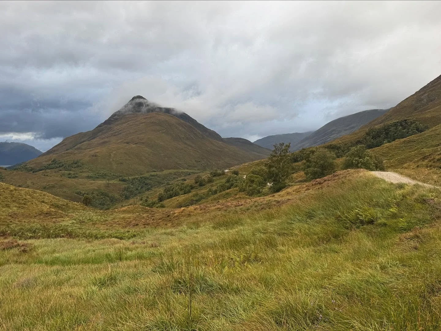 Trekking across the Scottish Highlands. Doing our best to get lost. #wildcamping #singingintherain