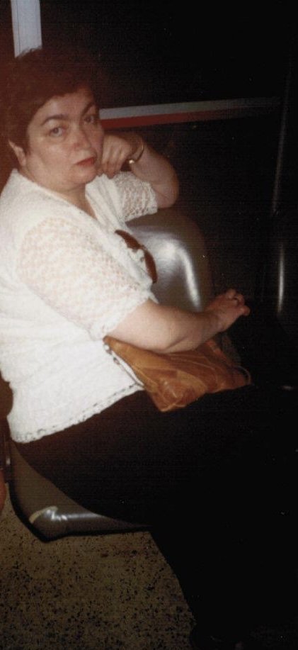 Mom waiting for my sister to arrive at the JFK arrivals terminal. June 1996.